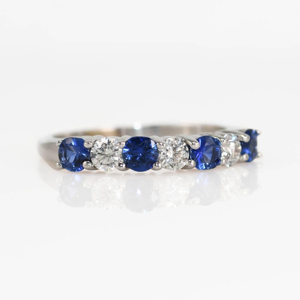 18K White Gold Blue Sapphire & Diamond Ring, 3.7g
Ladies sapphire and diamond ring with 18k white gold setting.

Stamped 18k and weighs 3.7 grams gross weight.

The blue sapphires are round brilliant cuts, excellent color, .60 total carats.

There