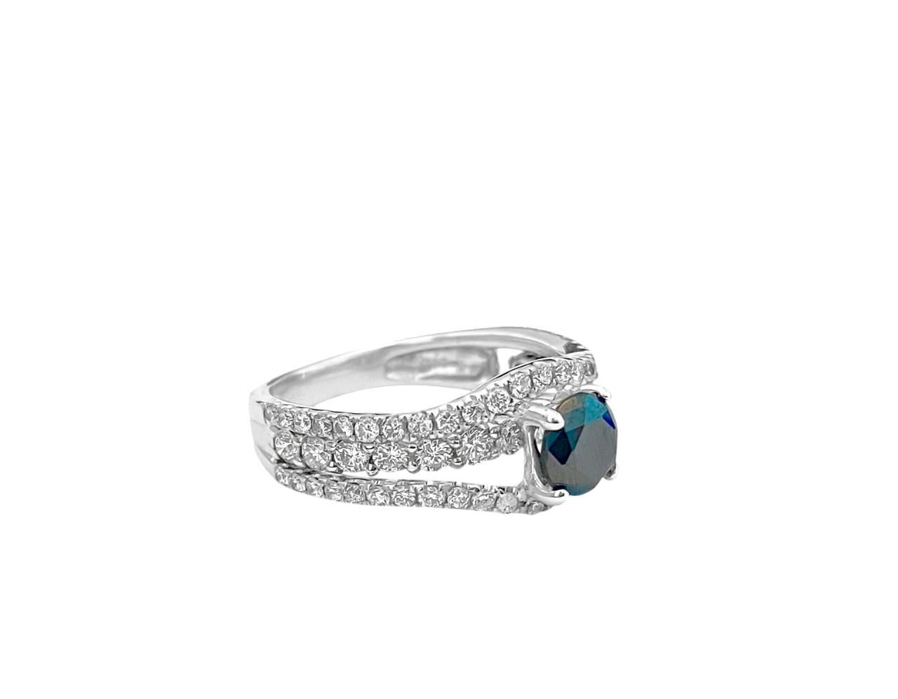 Introducing this stunning ring crafted from 18k white gold, adorned with a total of 1.50 carats of round brilliant-cut diamonds with VS2-SI clarity and G color, complemented by a vibrant round blue sapphire center stone, approximately 0.80 carats.