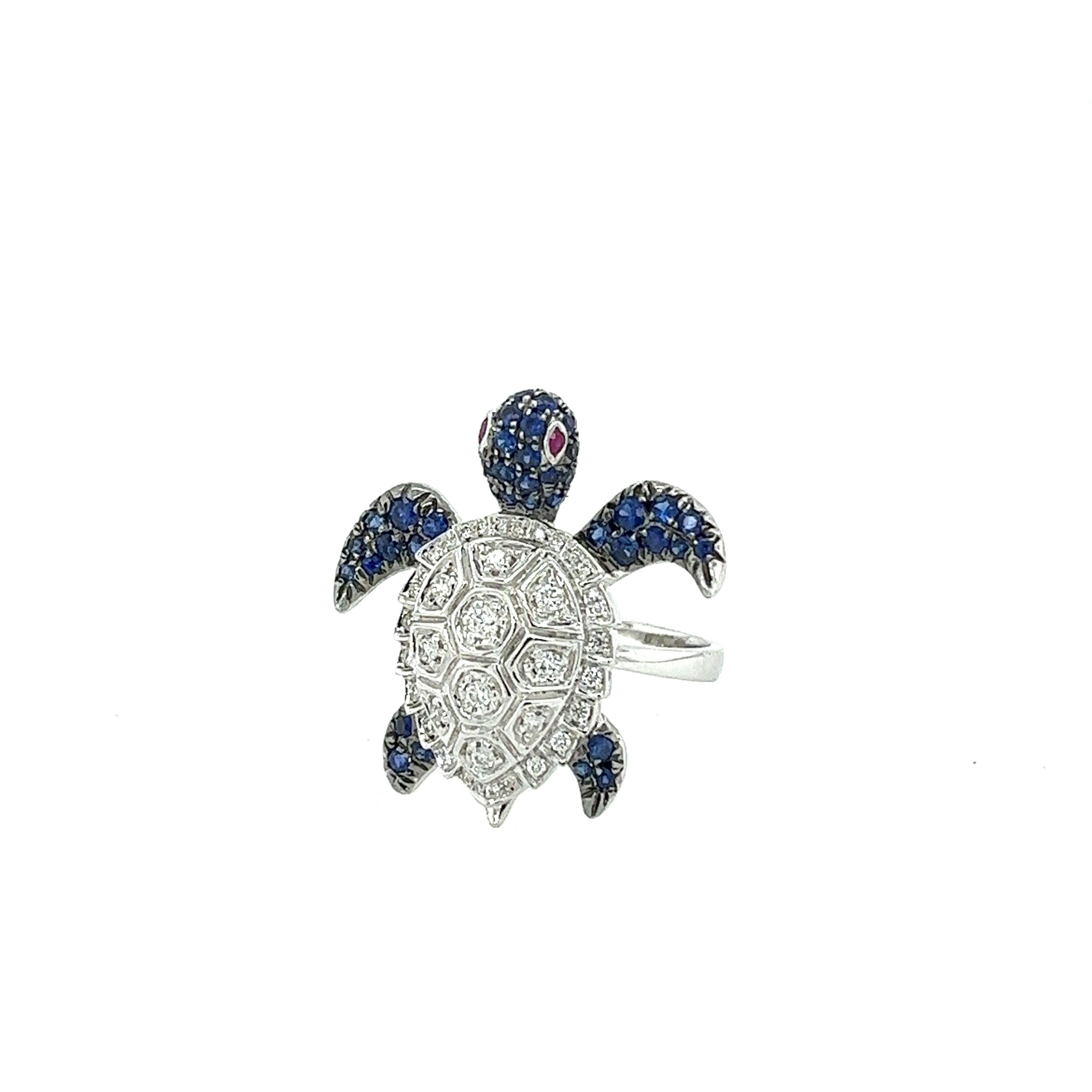 18K White Gold Blue Sapphire Turtle Ring with Diamonds

42 Blue Sapphires - 0.63 CT
38 Diamonds - 0.26 CT
2 Rubies - 0.02 CT
18K White Gold - 6.48 GM

Turtle represents intuitive development, protection, wisdom, patience, and determination. As a