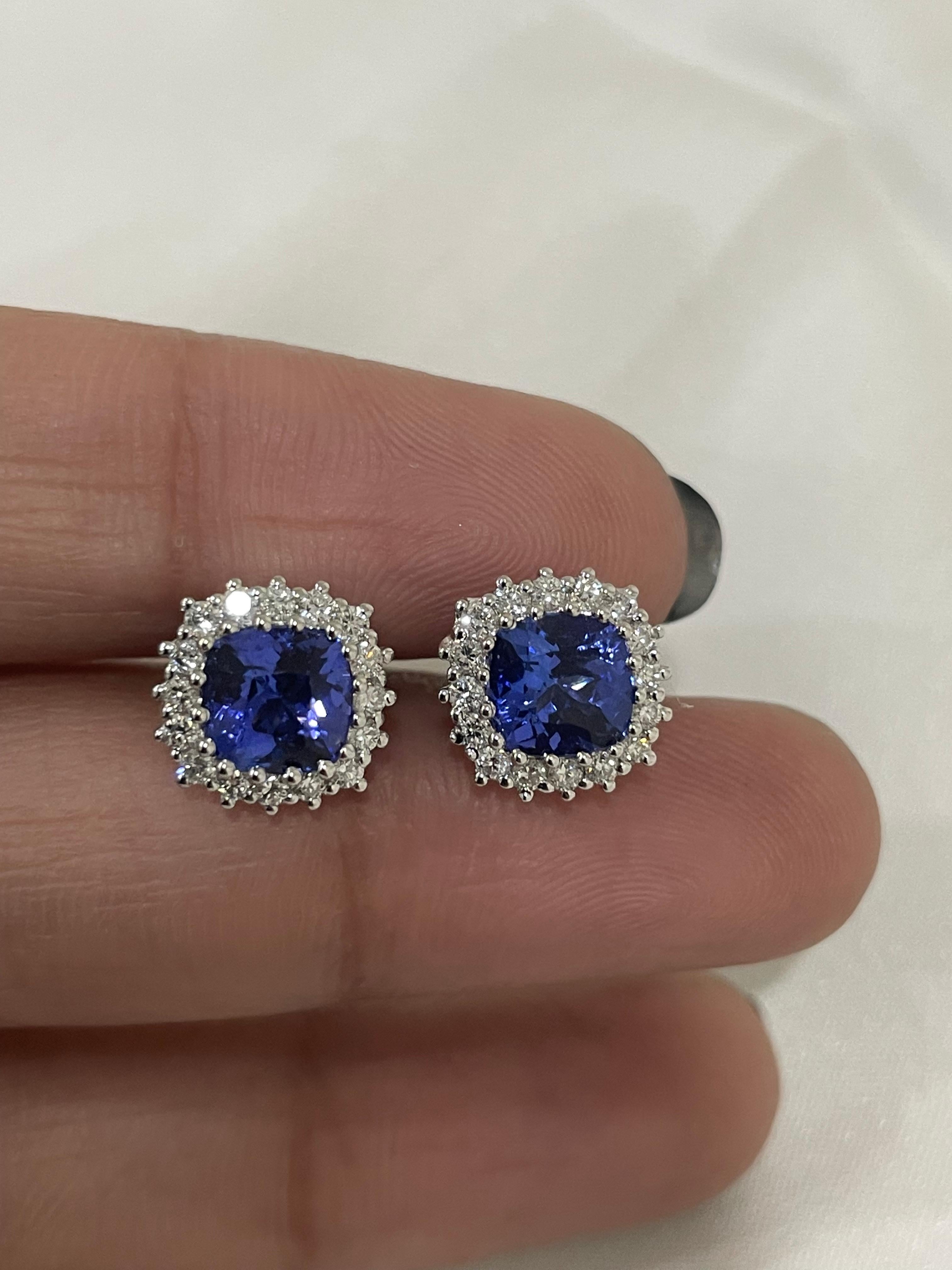 Studs create a subtle beauty while showcasing the colors of the natural precious gemstones and illuminating diamonds making a statement.

Cushion cut tanzanite studs with diamonds in 18K gold. Embrace your look with these stunning pair of earrings