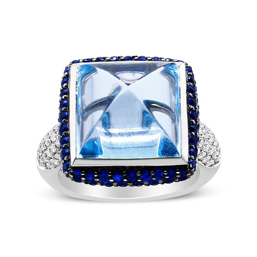 This beautifully designed ring features a cushion London blue topaz secured within an elegantly thin bezel setting; furthermore, this translucent blue gem is framed with a halo of stunning vivid blue sapphires for a tantalizing contrast. Finally, we