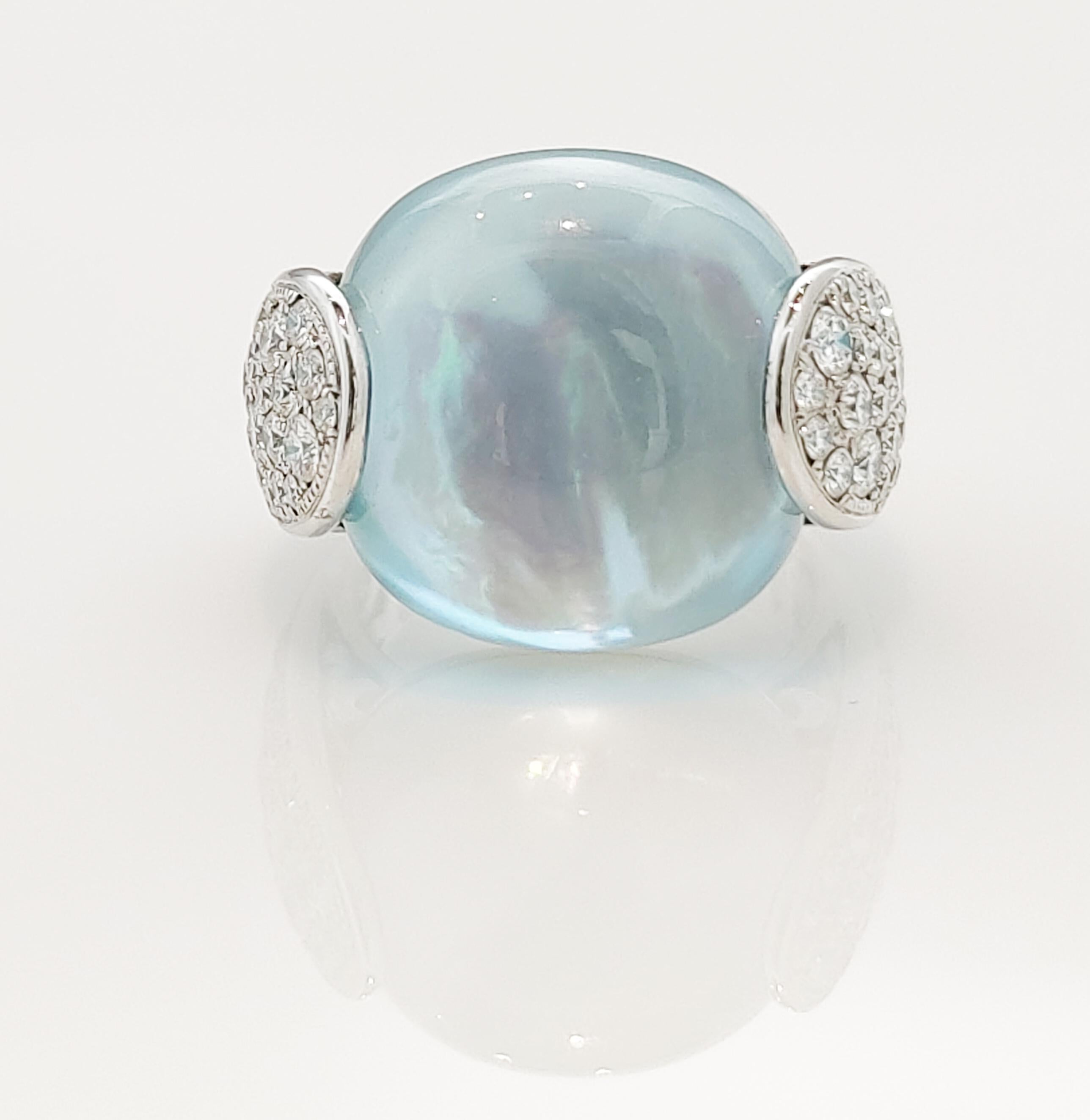 Ladies will love this blue topaz over mother of pearl doublet and diamond ring in 18K white gold. Set in the ring is a 30.23 carat cushion cut blue topaz over mother of pearl doublet and 73 round diamonds with a total weight of 1.76 carat.

The ring