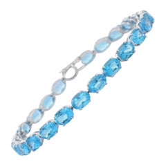 18K White Gold Blue Topaz Oval Cut Tennis Bracelet