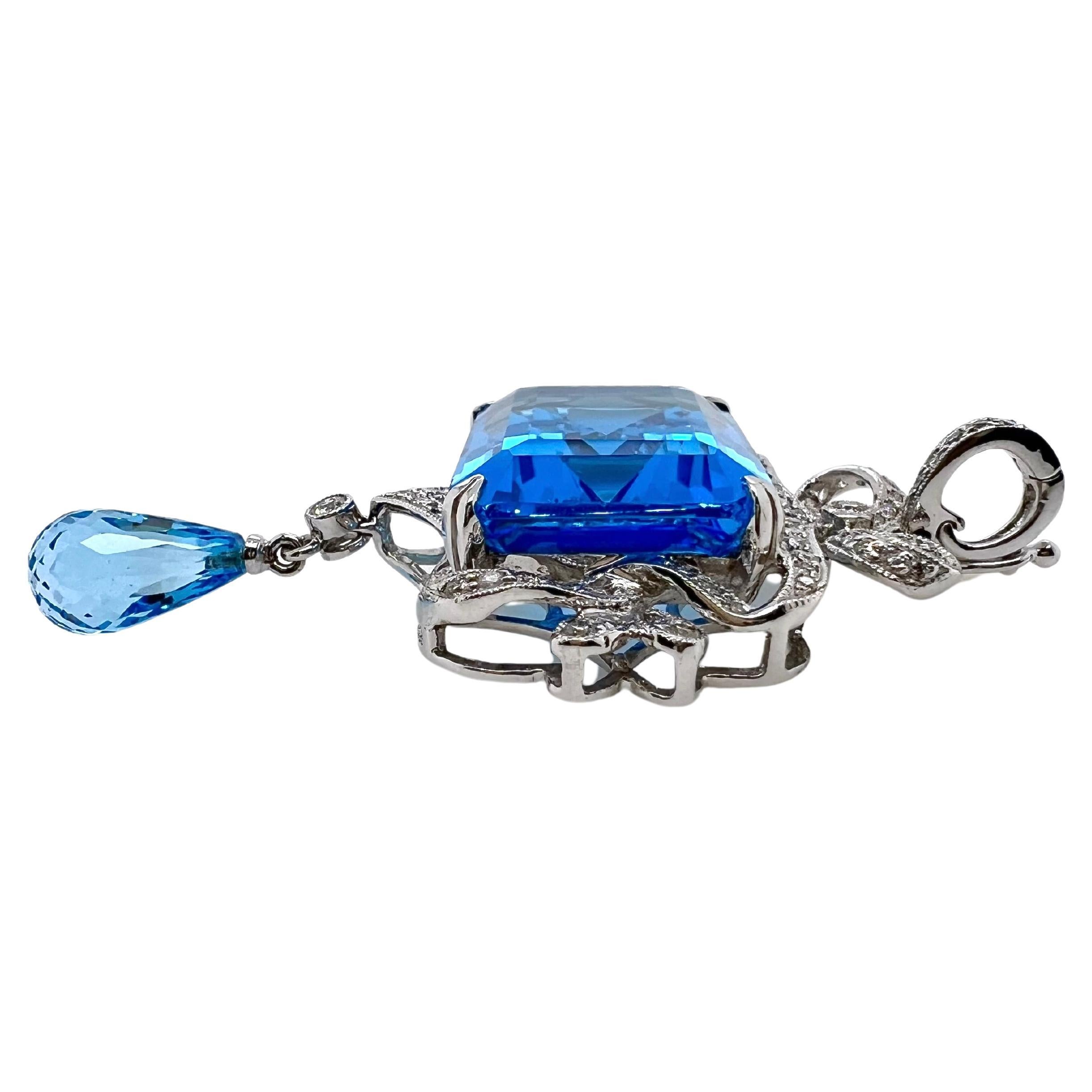 Contemporary 18k White Gold Blue Topaz Pendant with Diamonds For Sale