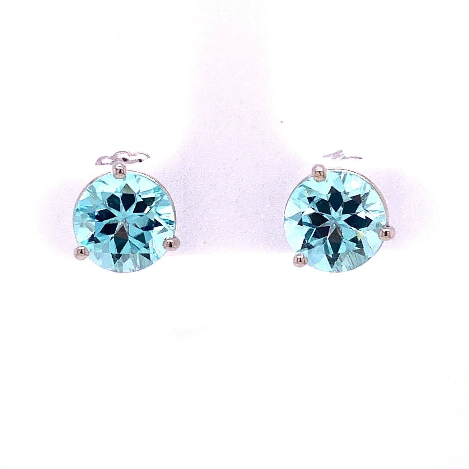 A pair of 18k white gold studs set with 4.11 carats of round blue tourmaline, with a pair of white speckled druzy wing jackets set in sterling silver. These earrings were made and designed by llyn strong.

Items sold separately upon request.