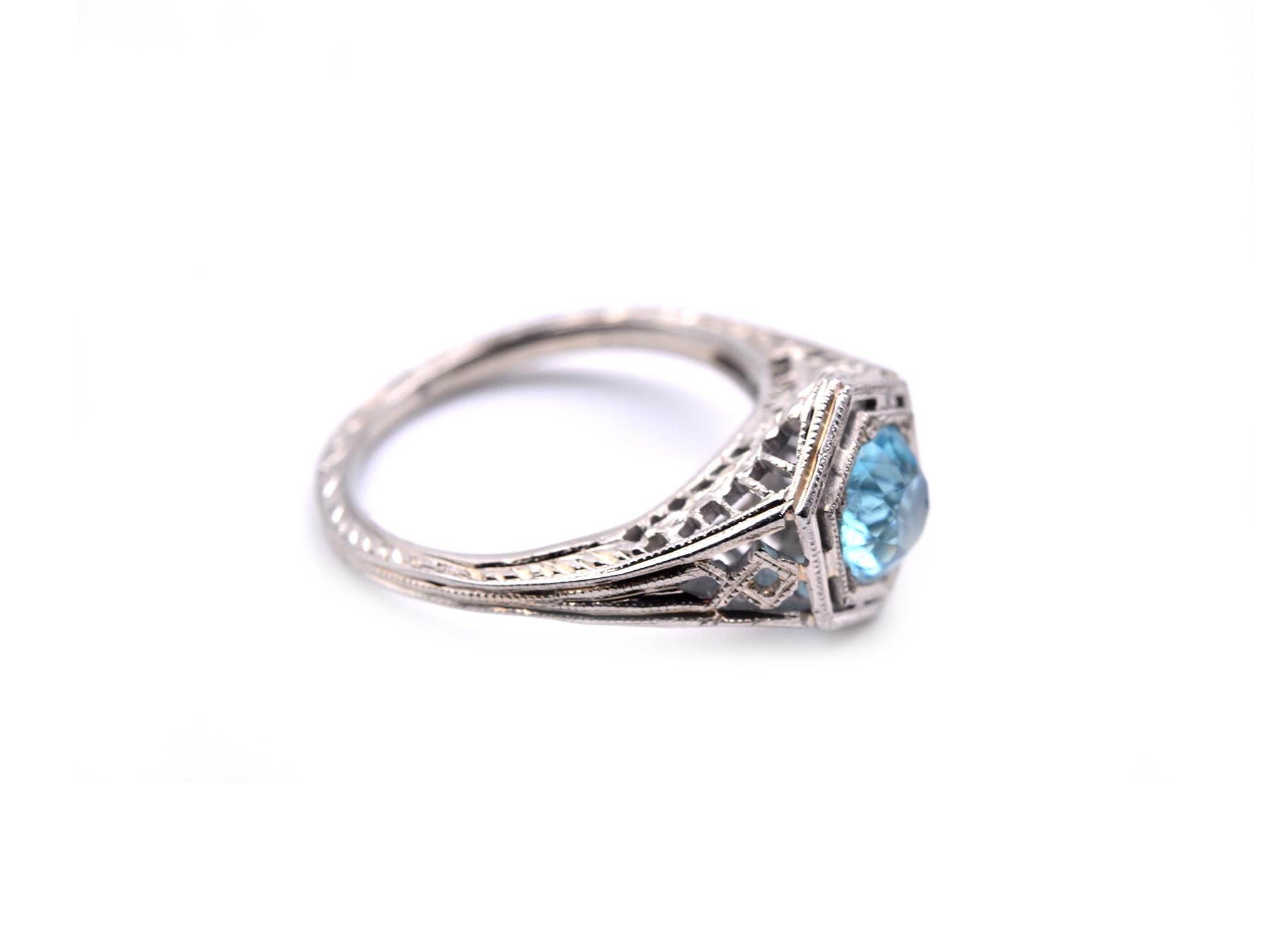 Designer: custom design
Material: 18k white gold
Blue Zircon: one blue zircon=0.85ct
Ring size: 3 ¾ (please allow two additional shipping days for sizing requests)
Dimensions: ring is approximately 9.56mm by 7.88mm
Weight: 2.44 grams
