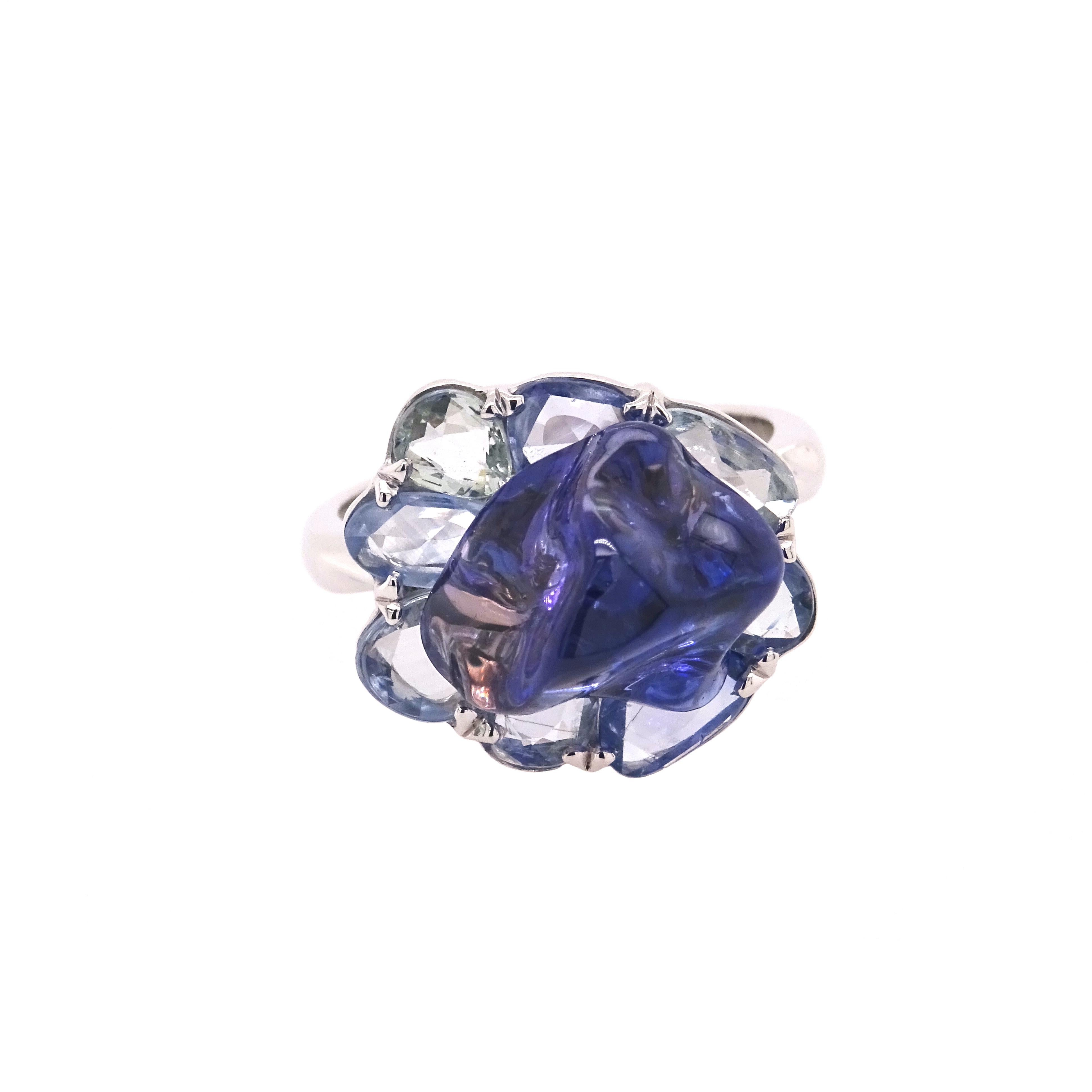 Organic Collection by VOTIVE.

Introducing VOTIVE's Organic Collection, a stunning showcase of nature's beauty and artistry. Behold this exquisite 18K white gold ring, adorned with a naturally shaped blue sapphire that crowns the petal-inspired
