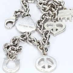 18k White Gold Bracelet with Diamond Charms: Elephant Heart Peace