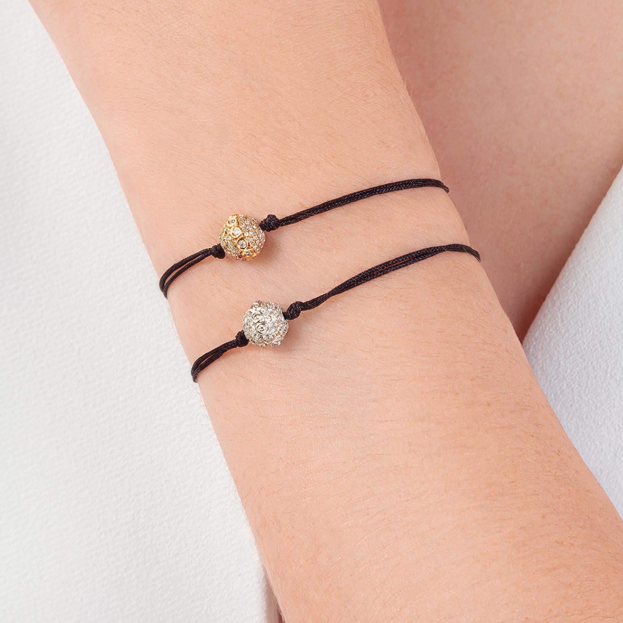 Introducing a refined twist on a classic design, this bracelet by THEVAULT15 features a smaller version of our signature free-turning 18-karat white gold sphere, exquisitely crafted by hand. The orb, measuring 8mm (0.31 inches), is encrusted with