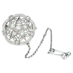 Brosche aus 18k Weißgold mit Sternmotiv und Diamanten im europäischen Schliff