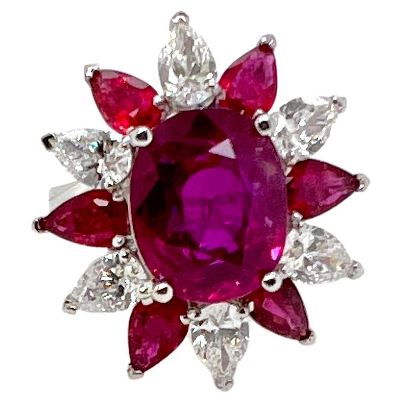 This immaculate 7 carat Heated Burma Ruby is set in a custom mounting with alternating pear shaped rubies and pear shaped diamonds in 18k white gold.  The GIA certified ruby is absolutely stunning given the rarity and difficulty to find a large