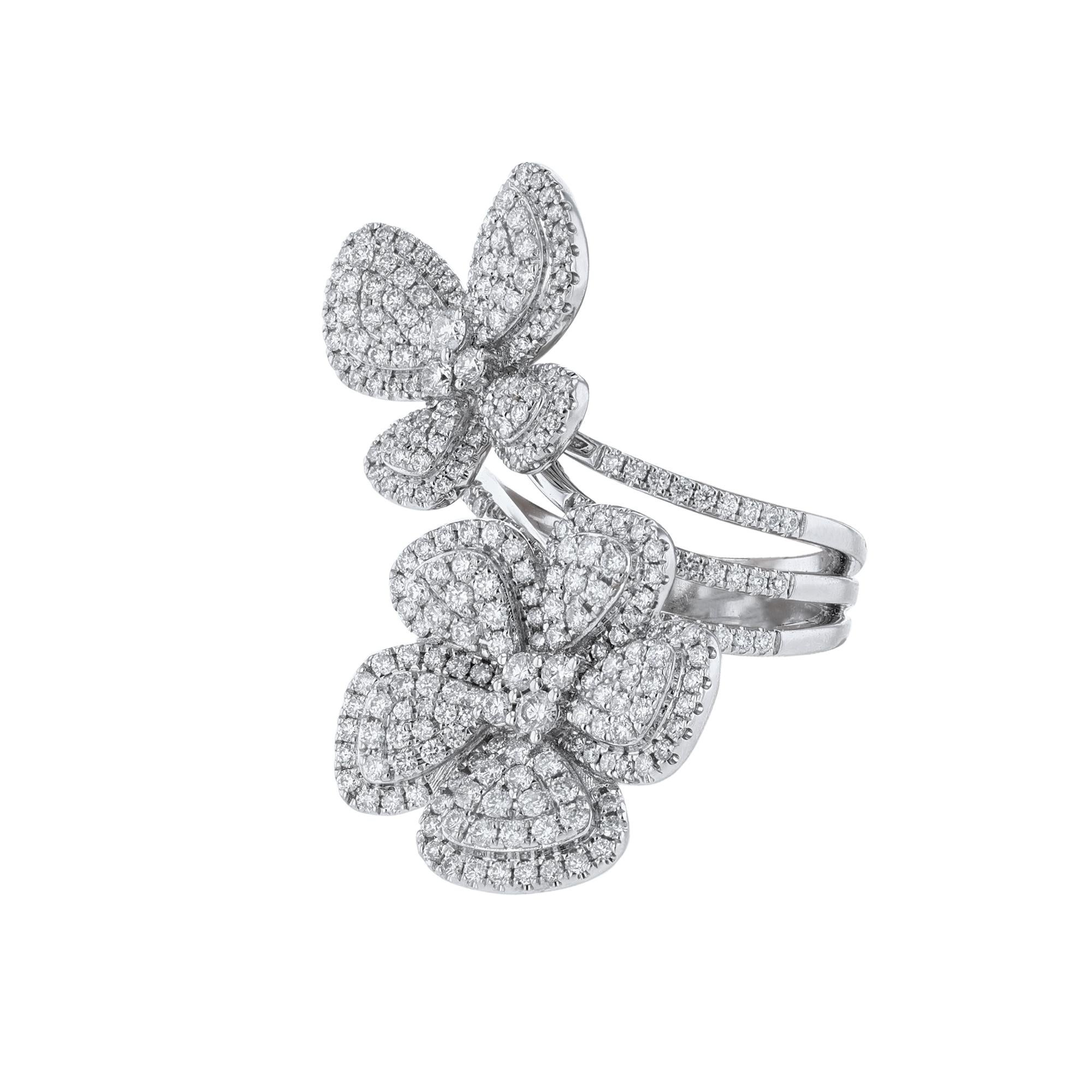 This ring is made in 18K white gold and features a flower and a butterfly. Made out of 305 round cut diamonds weighing 1.85 carats. With a color grade (I) and clarity grade (SI2). All stones are prong set.
