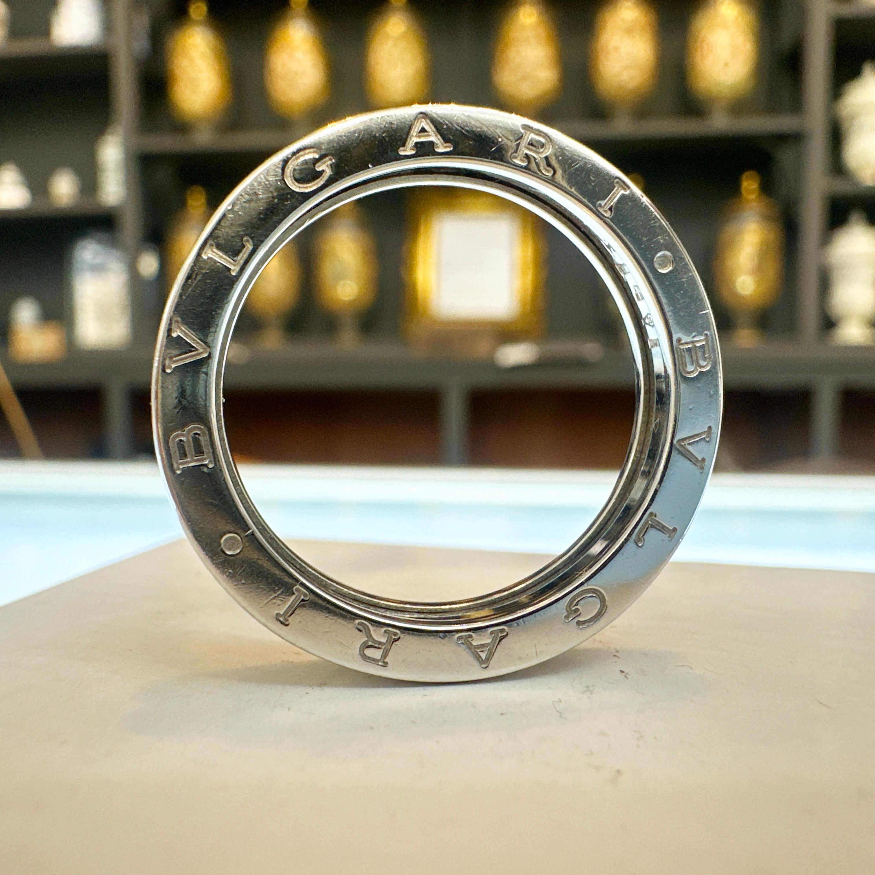 Here is a beautiful estate 18k White Gold BVLGARI B.ZERO 1 Ring.

This ring measures 4.80mm in average width and 2.75mm in average thickness. Features a rectangular band with flat sides with the BVGARI name engraved on both sides. Ring has just been