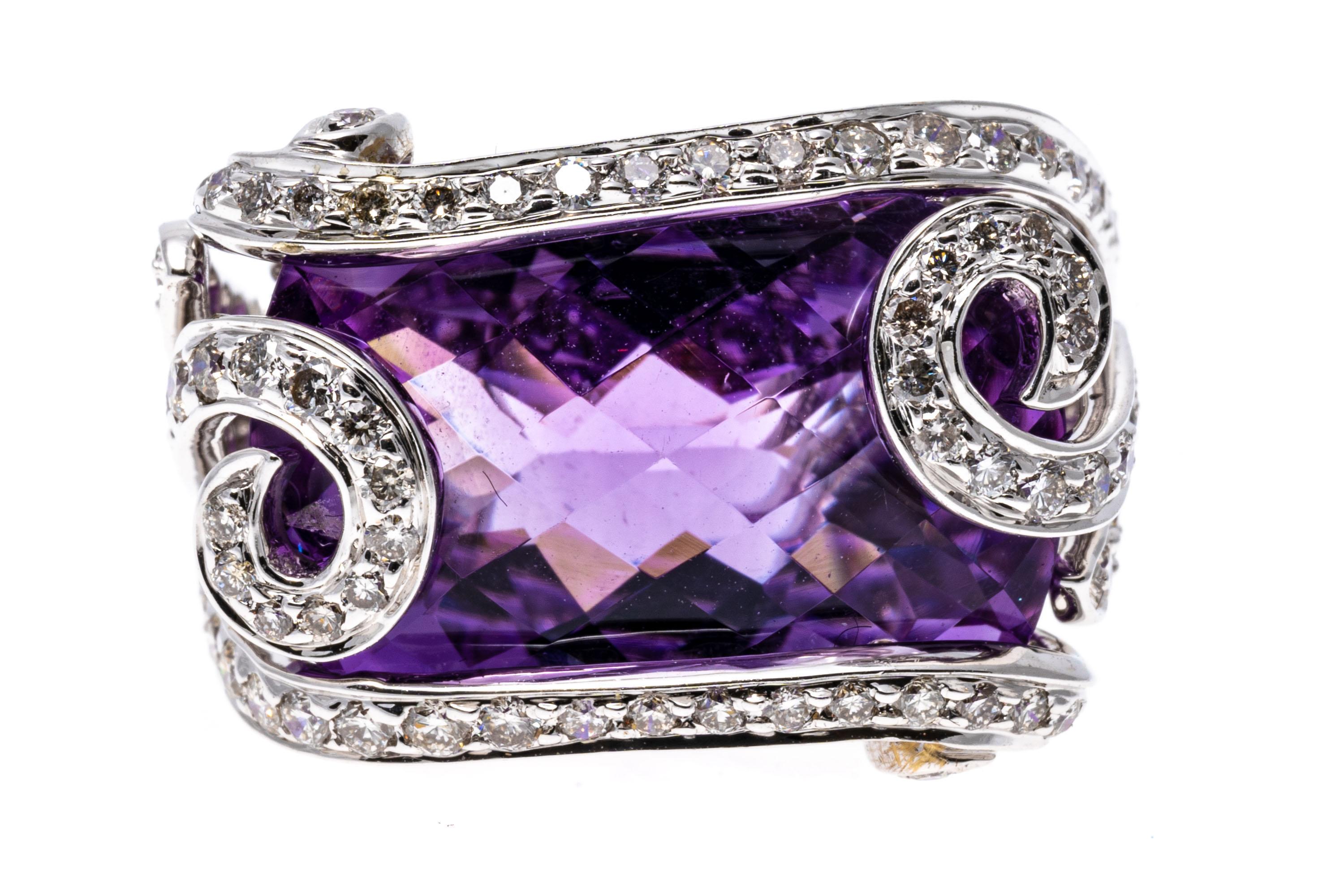 18k white gold ring. This unusual ring features a horizontal, rectangular checkerboard cushion, light purple color amethyst, set in a caged, swirled border and shank, set with round faceted diamonds, approximately 0.42 TCW.
Marks: 750
Dimensions: