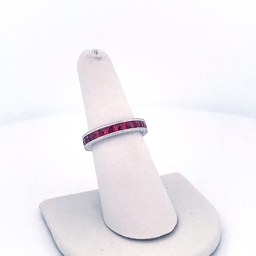 18k White Gold Calibre Ruby Eternity Ring In Excellent Condition For Sale In Dallas, TX