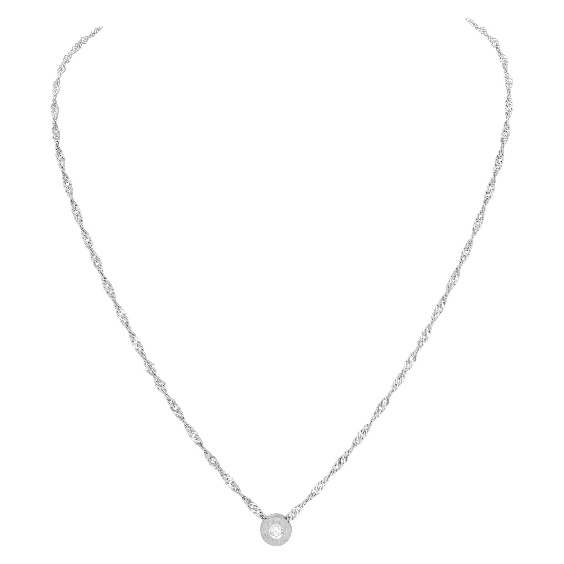 Delicate diamond pendant necklace on an 18k white gold chain with single 0.10 carat G-H color, VS clarity diamond. Length 17.5