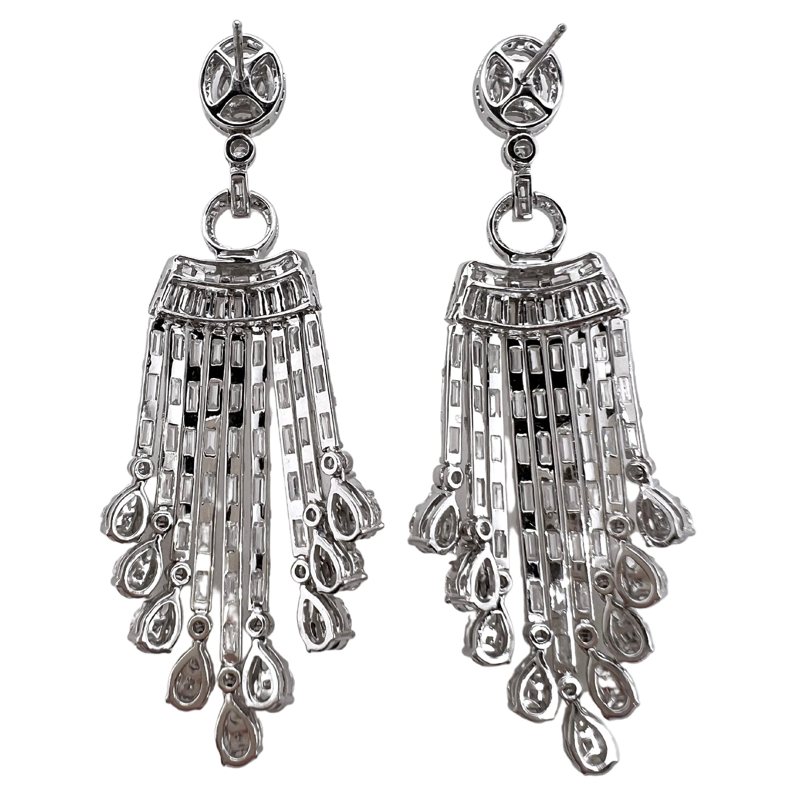 These immaculate dangling chandelier style diamonds earrings will be the talk of the event.  These are meticulously handmade with lines of baguette diamonds dripping and hanging from your ears.  The way the baguettes shine in the light will radiate