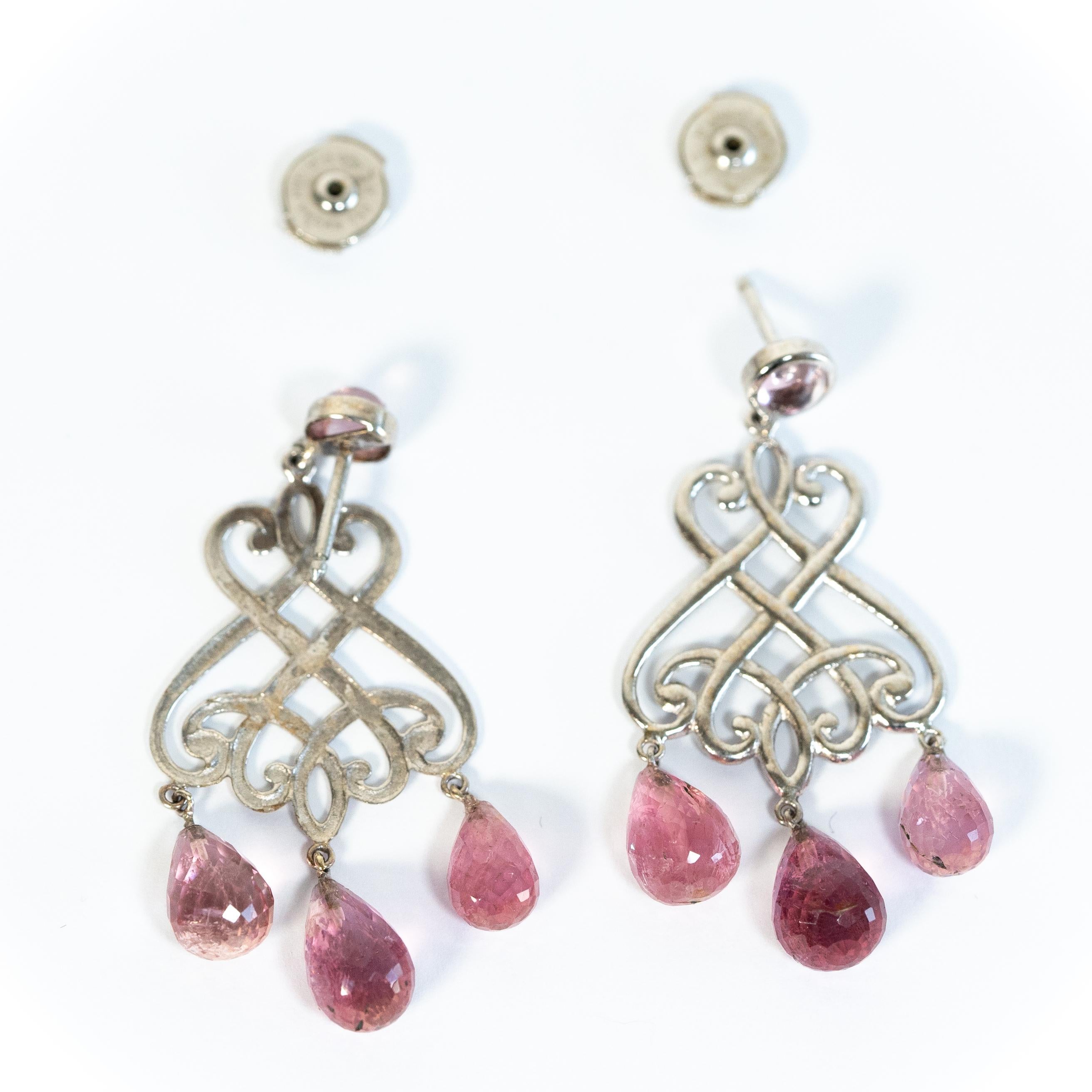 18K white gold chandelier earrings set with two pink tourmalines cabochons and six pink tourmalines briolettes.
Alpa security system.
earrings total weight : 7,69 g
Pink tourmalines cabochons : 1,18 carats
Pink tourmalines briolettes : 15,21