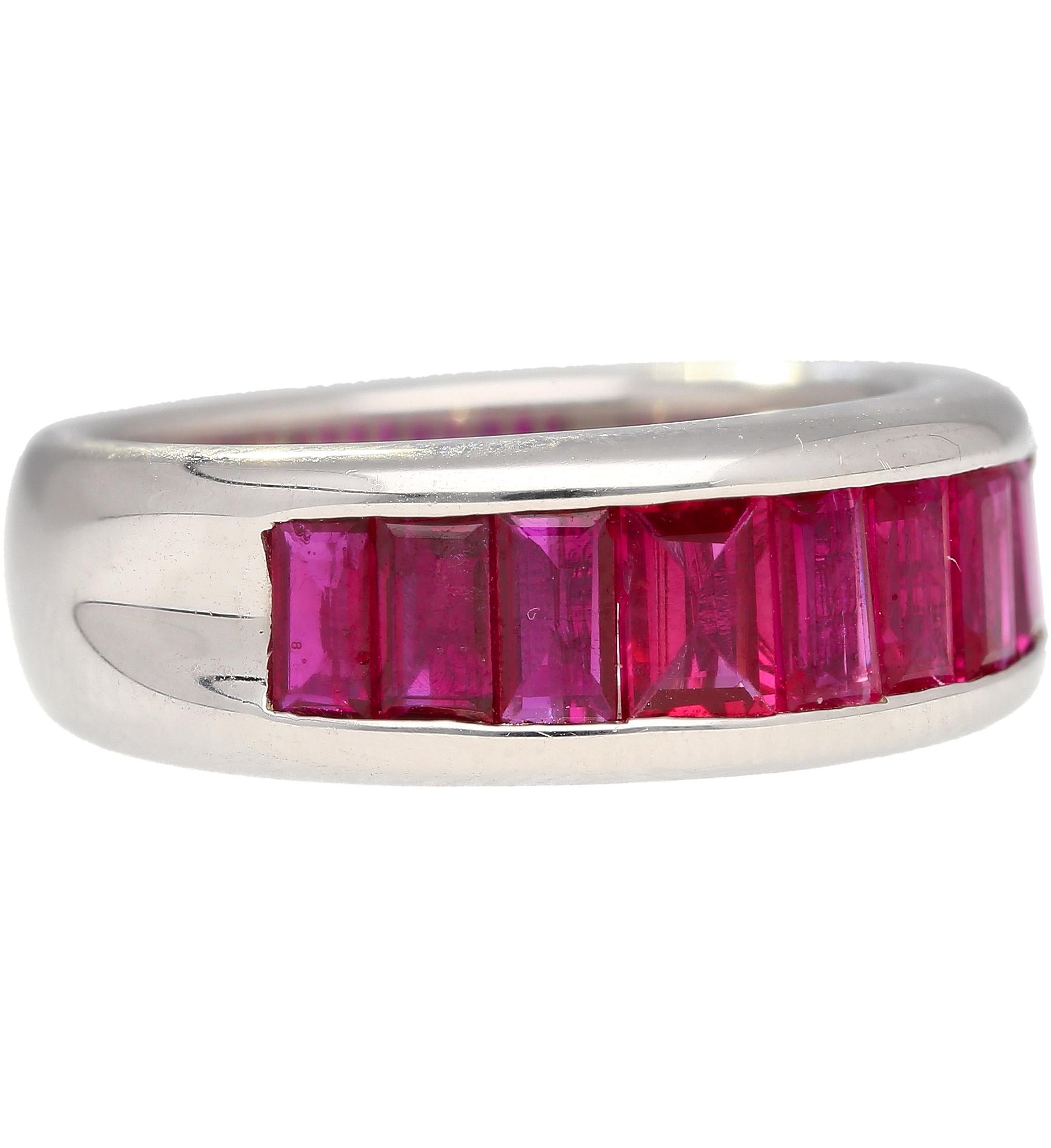 18k solid white gold sets this stunning natural baguette cut ruby ring. The rubies are channel tension set, with a seamless design that offers a glorious hall of mirrors effect when worn on the finger. Each ruby features a pinkish-red color hue and