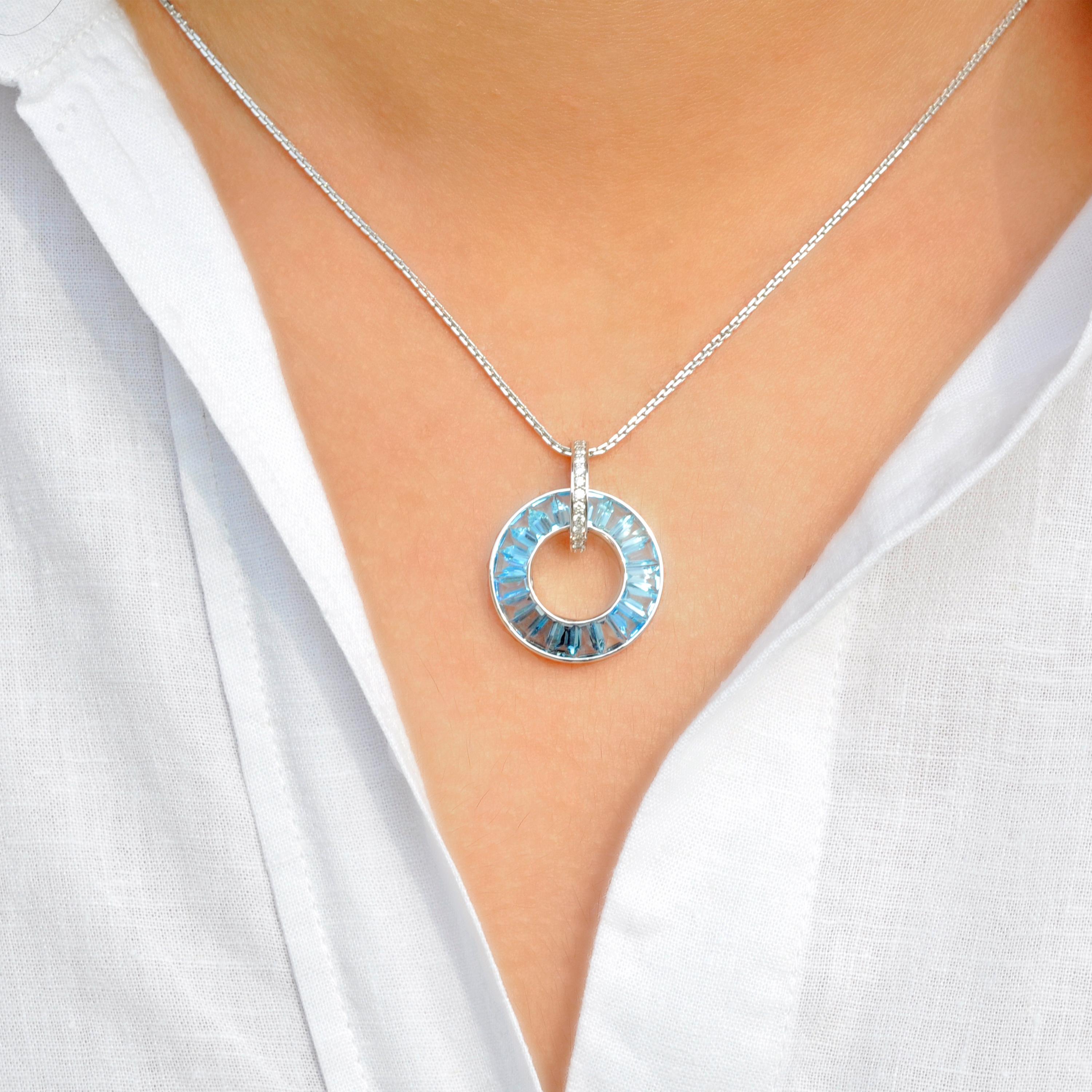 This 18K White Gold Blue Topaz Diamond Circle Pendant is a stunning embodiment of grace and sophistication. Crafted in luminous white gold, this pendant features a captivating circle adorned with the enchanting beauty of blue topaz gemstones.

The
