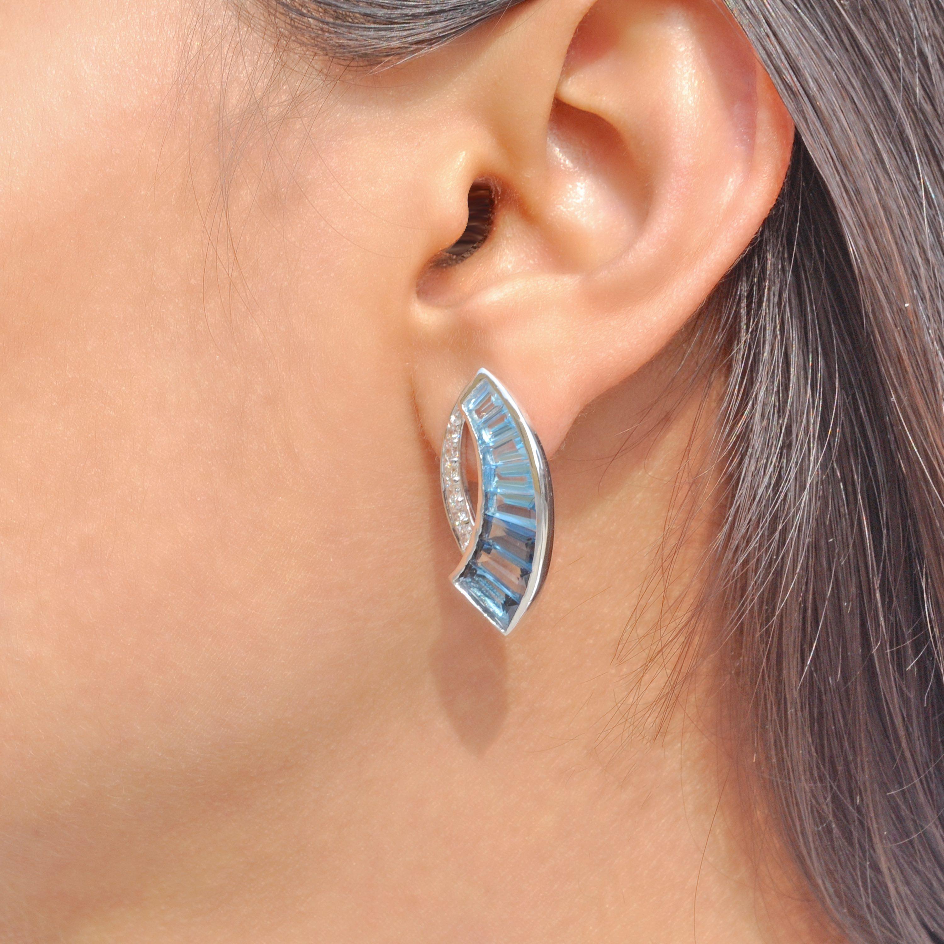 Contemporary 18K White Gold Channel Set Tapered Baguettes Blue Topaz Sword Stud Earrings For Sale