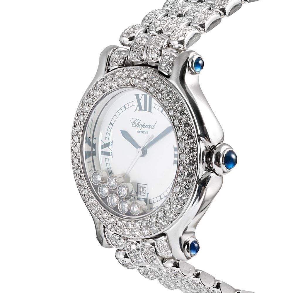 A stunning and glamourous watch for she who enjoys the brilliance of white diamonds, this watch is “blanketed in bling”! Diamonds float inside the case, gliding effortlessly across the dial and are also set in a double row on the bezel and on each