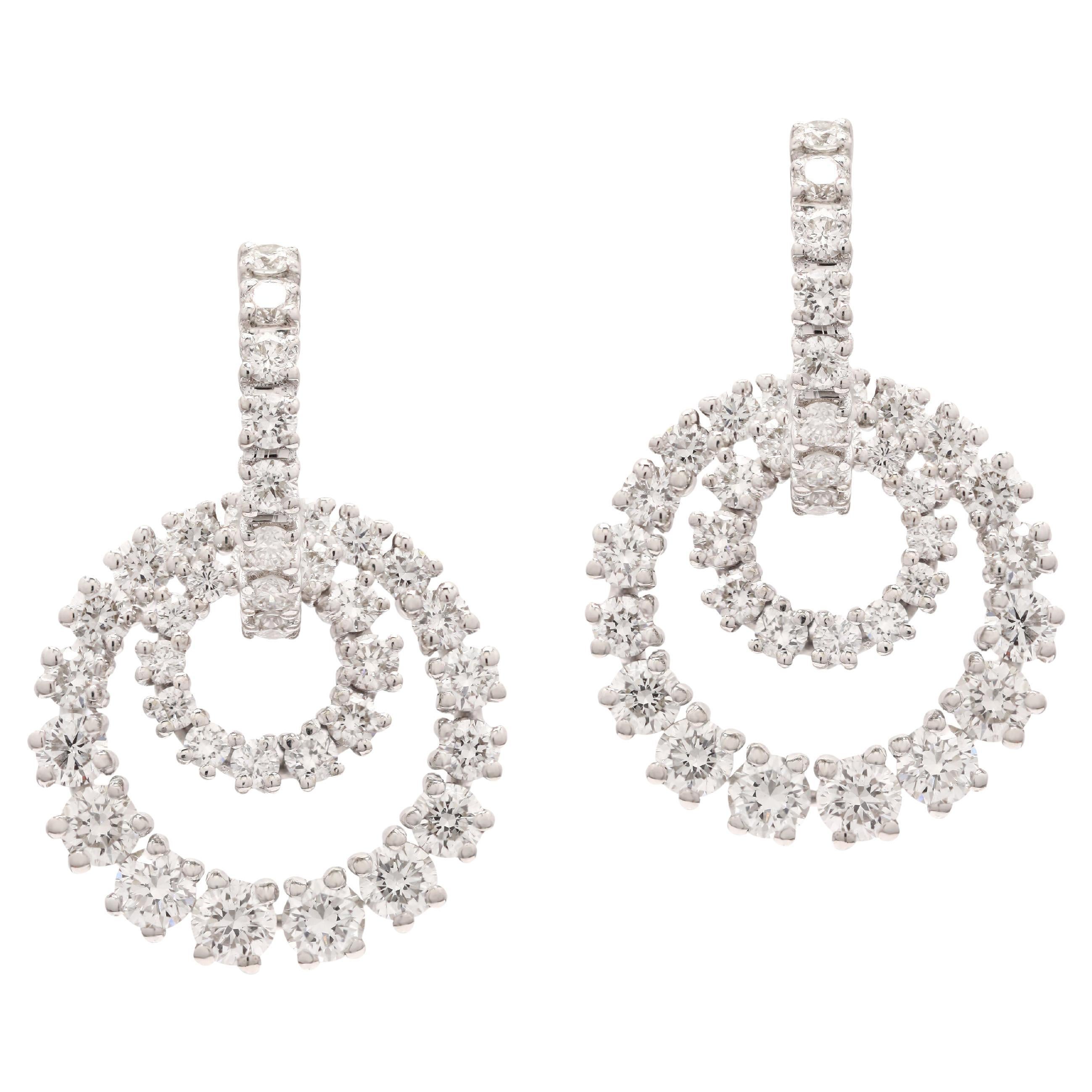 Circle Diamond Party Dangle Earrings for Women in 18K Gold to make a statement with your look. You shall need dangle earrings to make a statement with your look. These earrings create a sparkling, luxurious look featuring round cut diamonds .
April