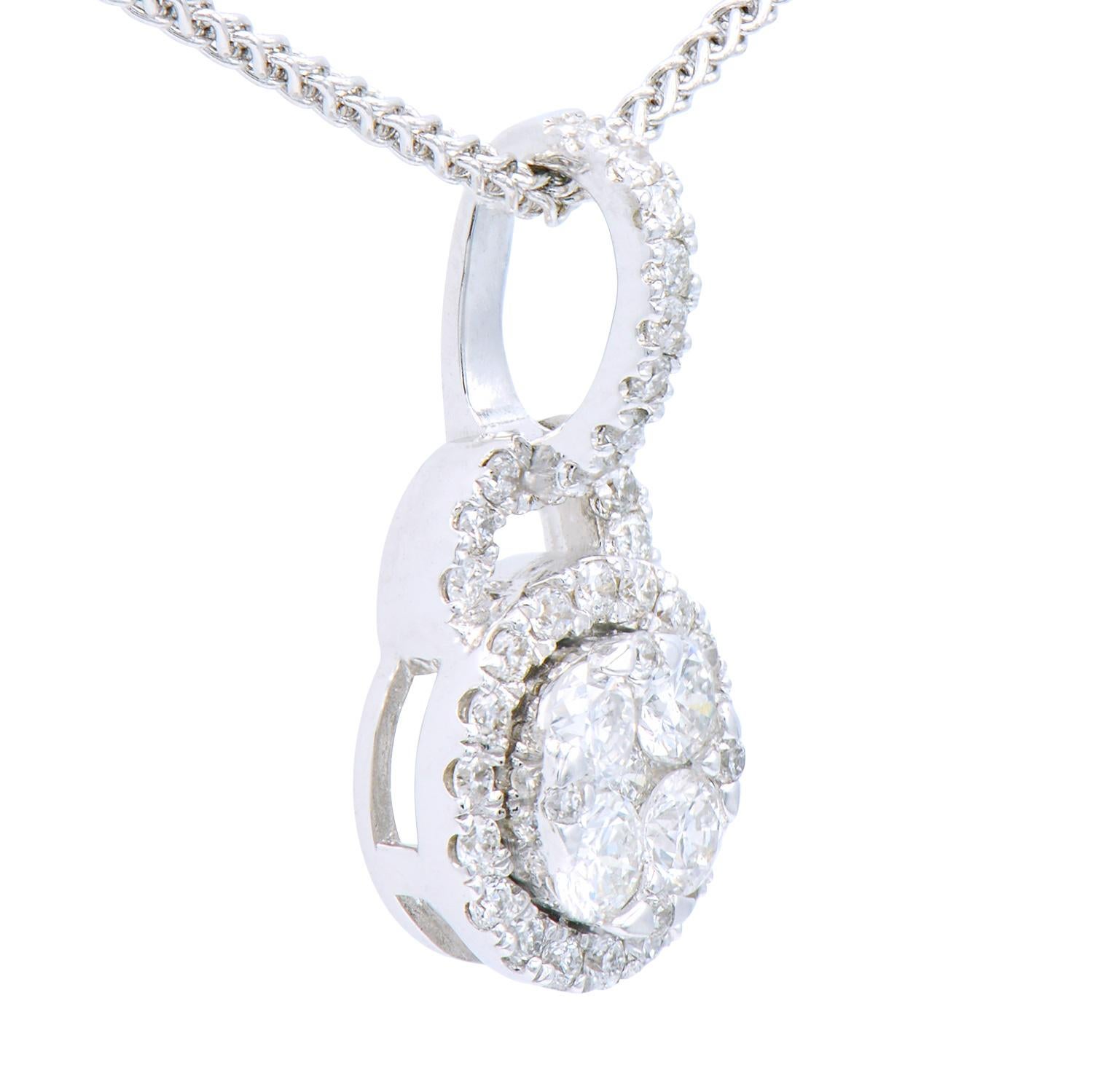 This beautiful circle pendant is made of 42 round VS2, G color diamonds totaling 0.34 carats of shining round diamonds. They are set in 1.32 grams of 18 karat white gold. This classic look is timeless and the perfect gift for any occasion.  An 18
