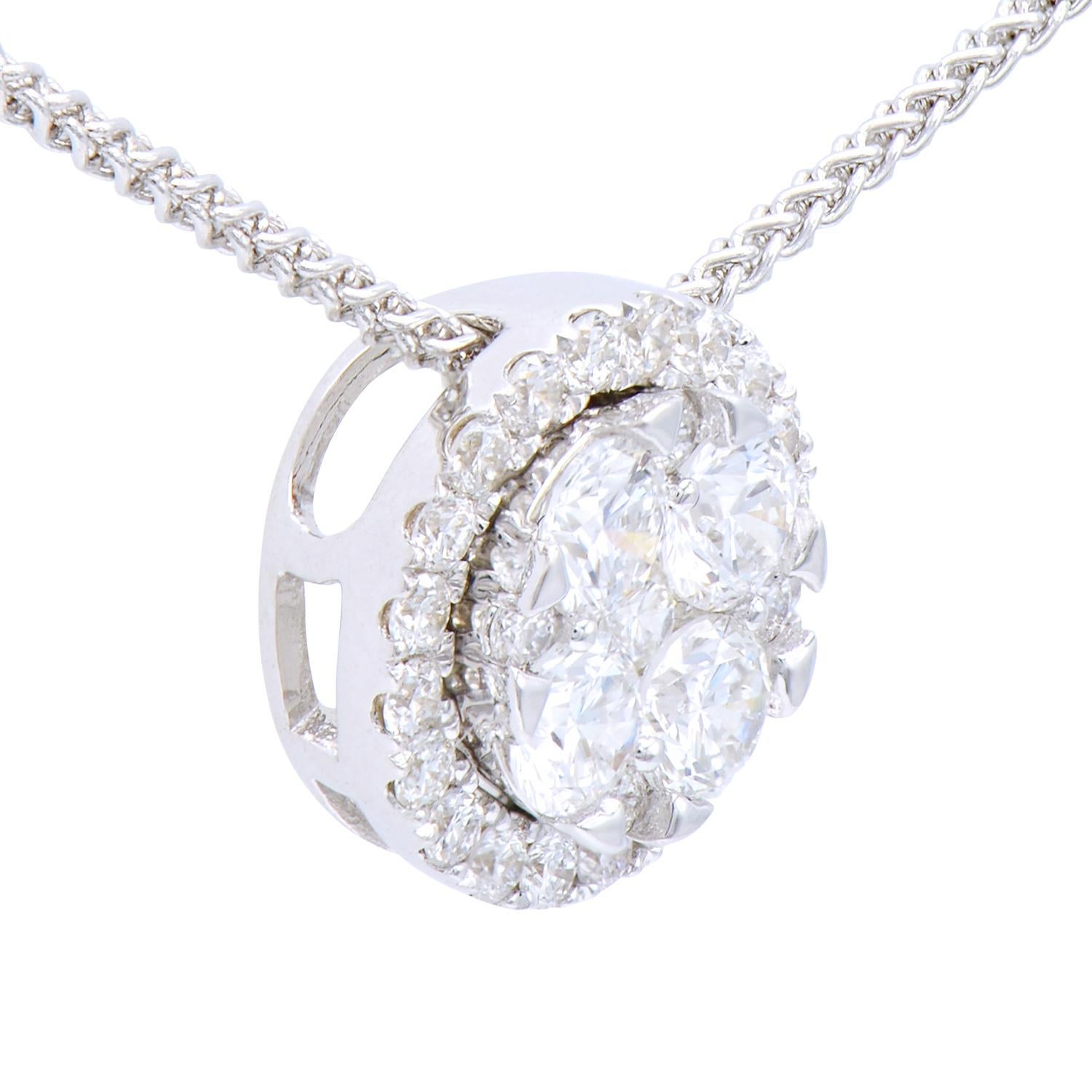 This beautiful circle pendant is made up of 4 diamonds of .35 carats surrounded by 25 round diamonds of 0.2 carats, all in VS2, G color. They are set in 1.0 gram of 18 karat white gold with a 18 karat chain as well. This classic look is timeless and
