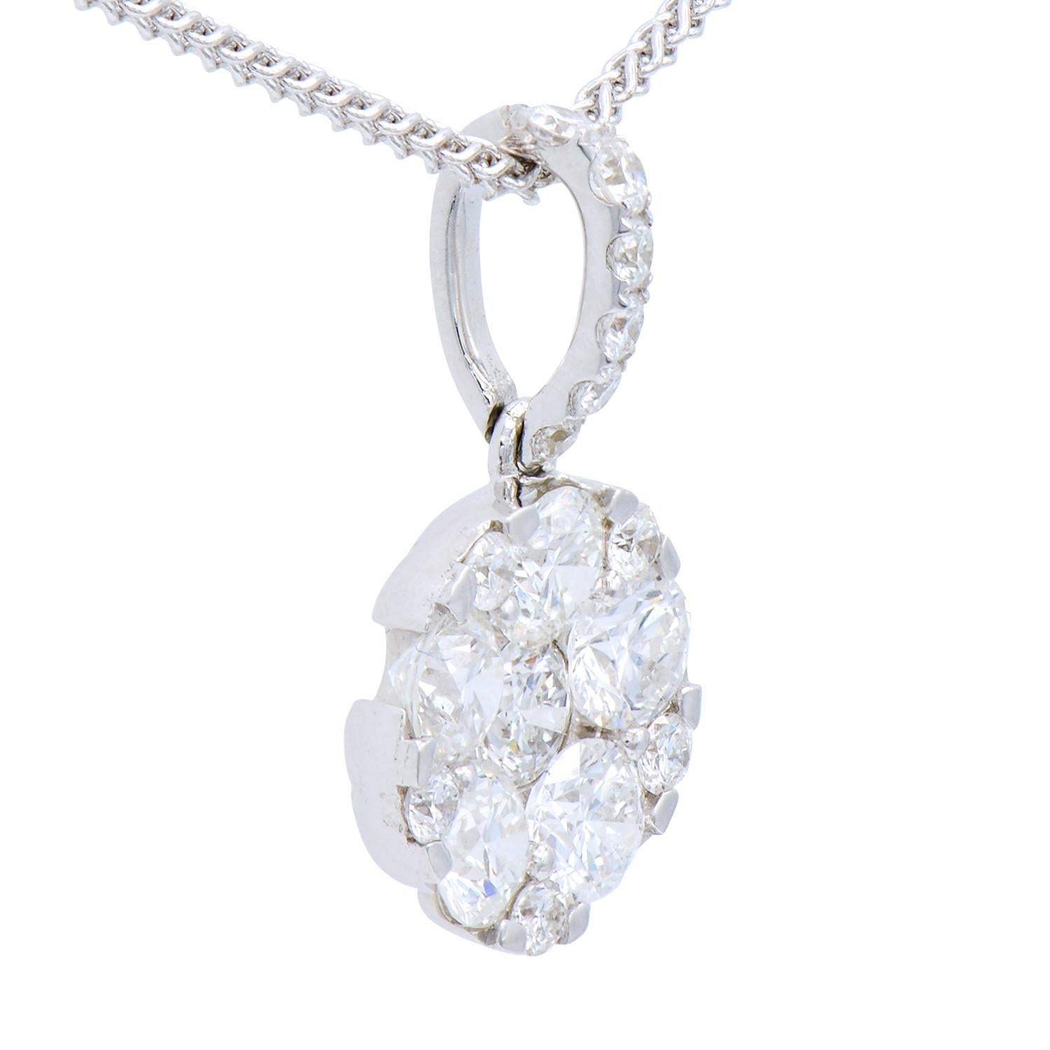 This beautiful circle pendant is made up of 17 diamonds totaling .91 carats, all in VS2, G color. They are set in 1.2 grams of 18 karat white gold with an 18 karat white gold chain as well. This classic look is timeless and the perfect gift.