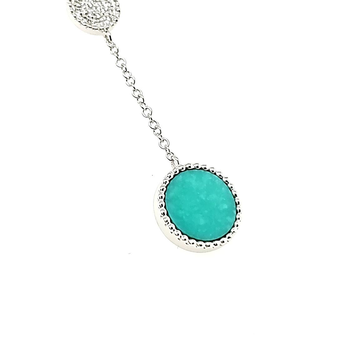 Channel your inner goddess while wearing this exquisite necklace.

Adorned with 19 round diamonds totaling 0.04 carats and a captivating turquoise gemstone from Persia, weighing 0.88 carats.

All elegantly set in 18k white gold, weighing 2.56