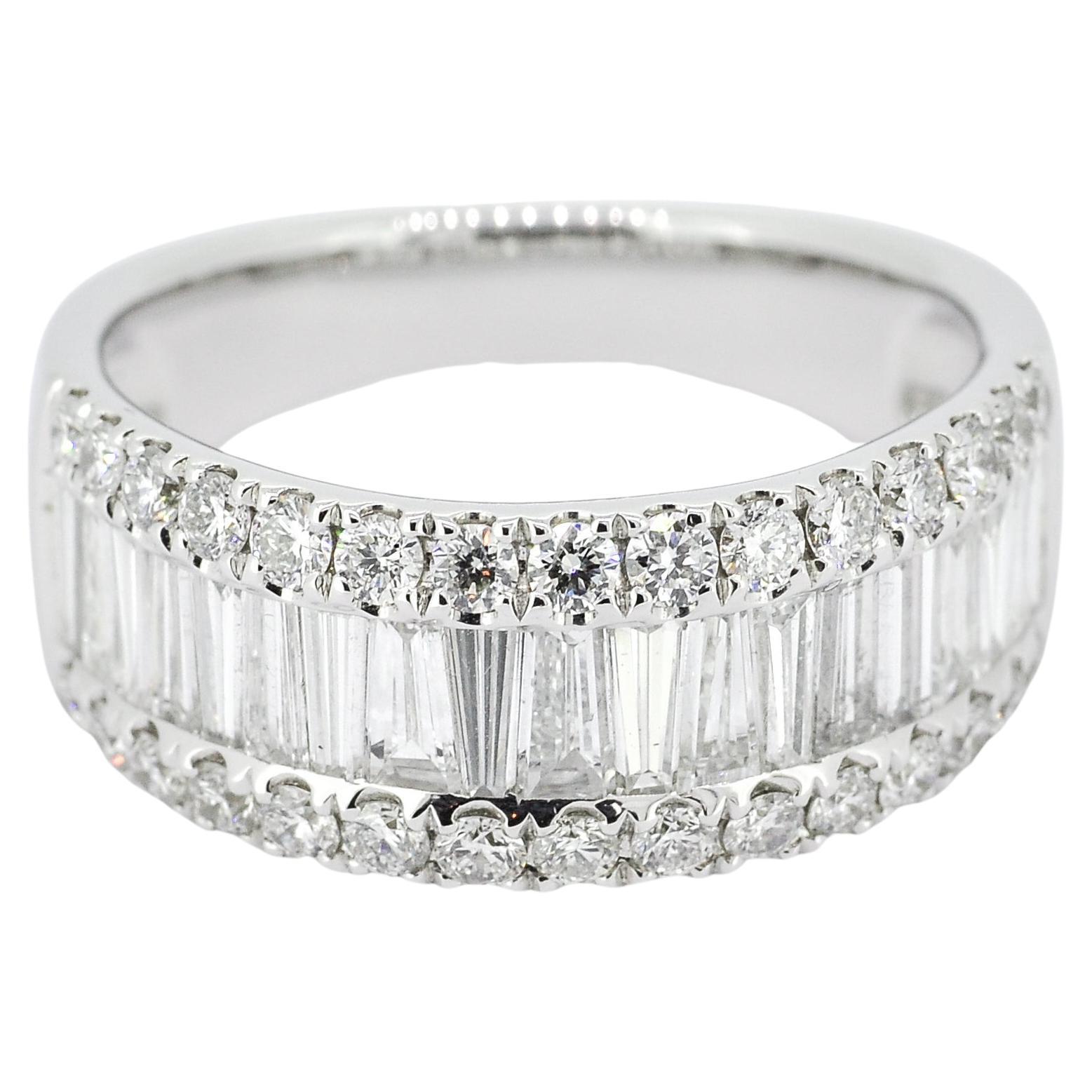 This 18K white gold anniversary ring features a timeless design with sparkling baguette diamonds set in a channel setting. The half-band design makes it perfect for everyday wear and pairing with other rings—a beautiful and enduring way to celebrate
