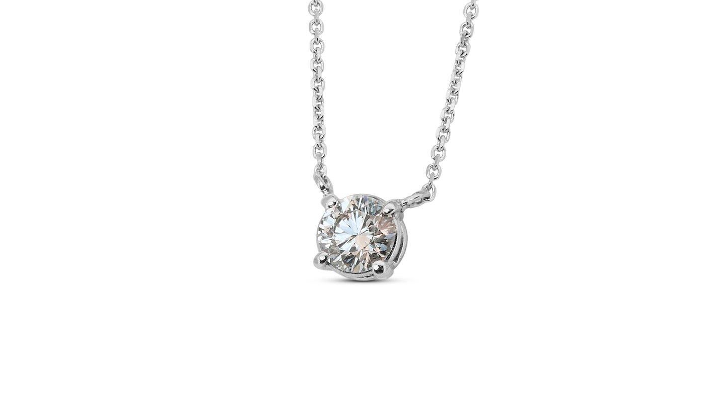 A classic solitaire necklace with a dazzling 0.33-carat round modified brilliant -rare diamond with over 100 facets made for brilliance natural diamond in F VVS1. The jewelry is made of 18k white gold with a high-quality polish. The main stone is