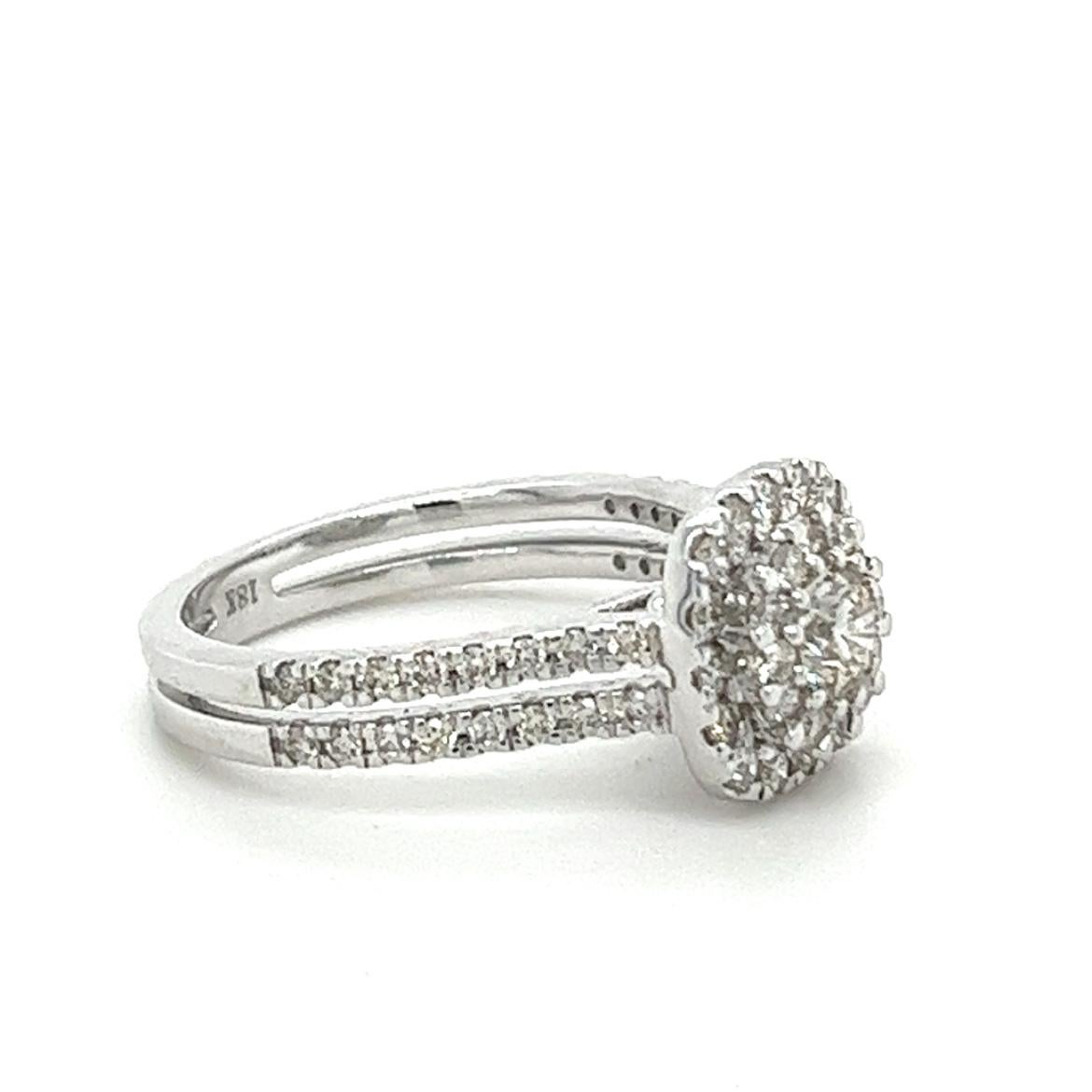 18K White Gold Classical Diamond Ring

 18K White Gold - 5.180 GM
 61 Diamonds - 0.990 CT

This exquisite 18K white gold ring is the epitome of timeless elegance. Crafted with the finest materials, it features a stunning diamond center stone that