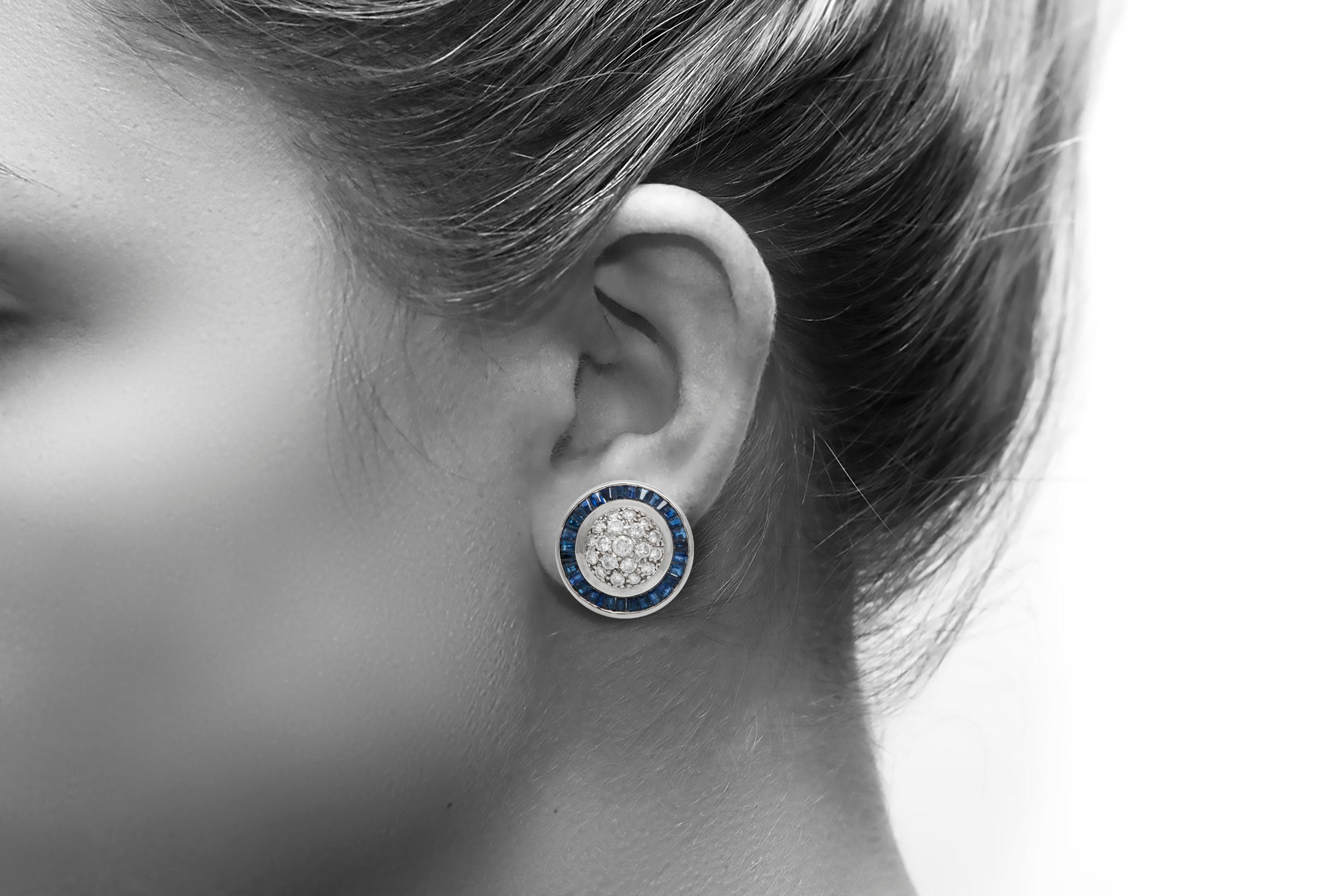 The earrings is finely crafted in 14k white gold with diamonds weighing approximately 1.50 carat and sapphire weighing approximately total of 5.00 carat.
