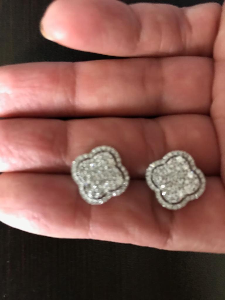 Clover diamond earrings set in 18K white gold. The earrings are set with round diamonds. The color of the stones are G, the clarity is VS1. The total weight of the earrings is 1.14 carats. 