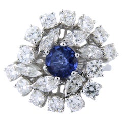 18k white gold cluster ring with a sapphire and diamonds