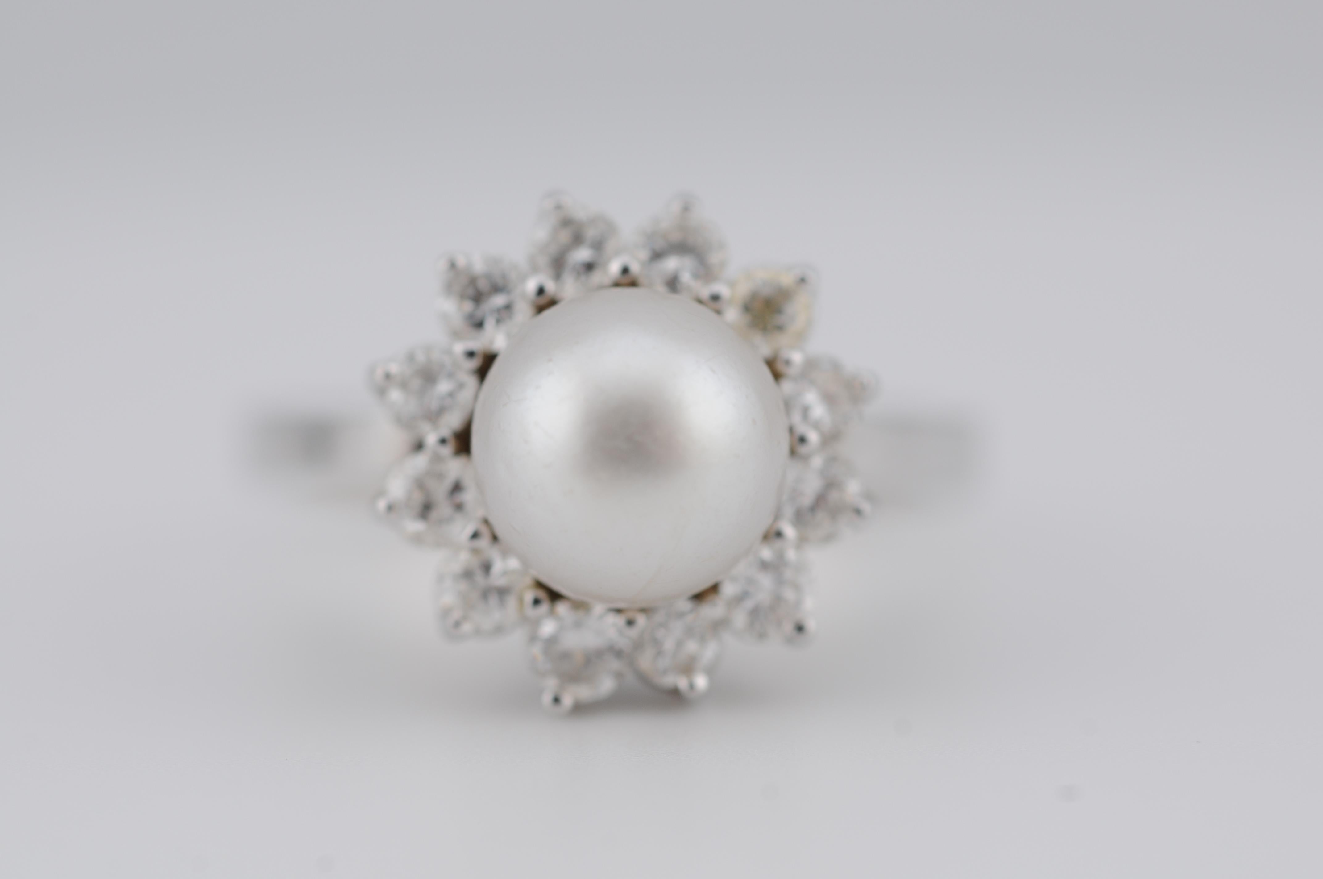 18k White Gold Cluster Ring with Cultured Pearl and Diamonds

Center: Cultured Pearl
Diamonds: 12 × Brilliant Cut
Color: G–H
Clarity: VVS2–VS2
Cut: Very Good
Carat: 12 × 0.05 ct
An elegant 18k white gold cluster ring, featuring a lustrous cultured
