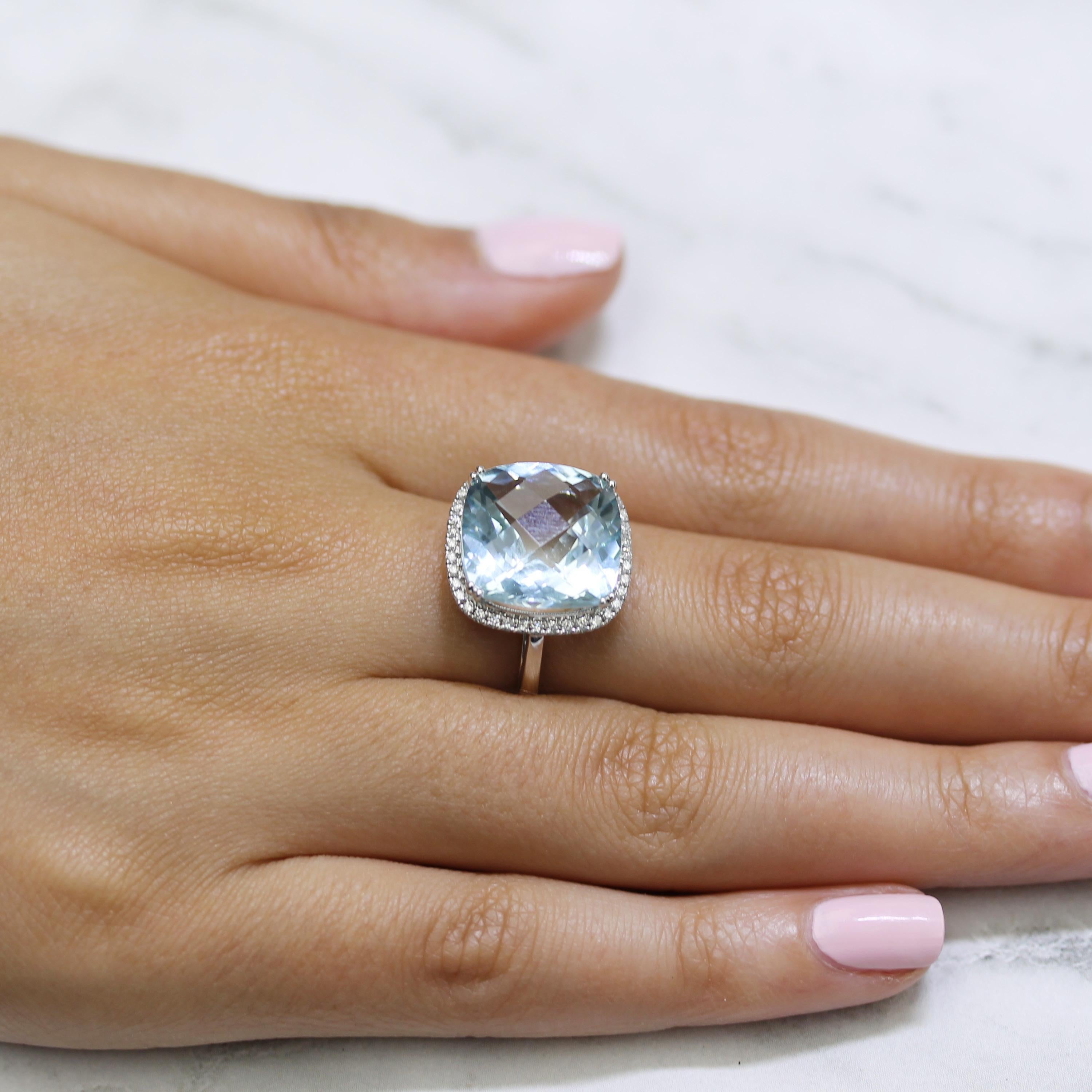 18K White Gold Ring Featuring Cushion-Cut Aquamarine, and Diamond Halo. Finger size 6.5, adjustable upon request/quote. Aquamarine evokes the purity of crystalline waters, and the exhilaration and relaxation of the sea. Item ref. R9498AQ.

Stone