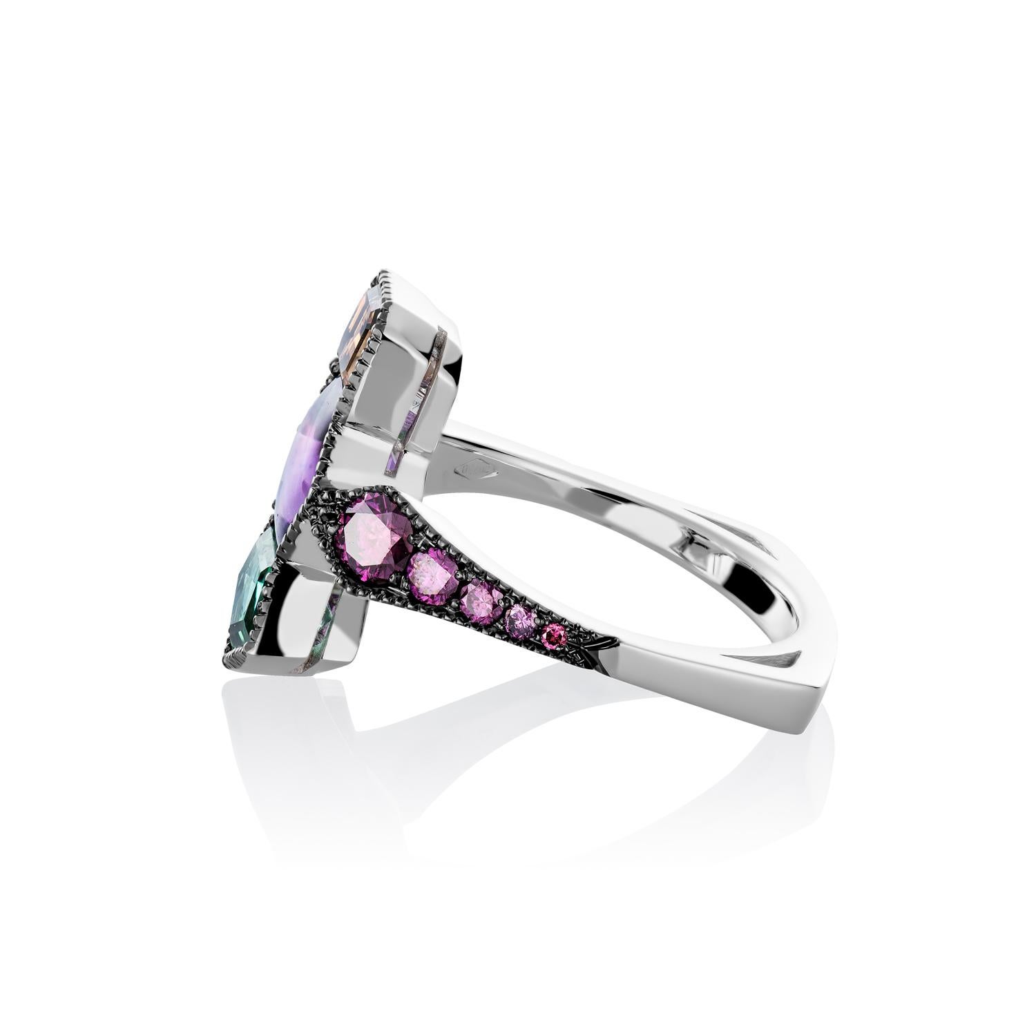 One of a kind Millegrain Ring in 18K White gold 6,1 g.  set with a Cognac diamond 0,54 ct., pentagon cut Tourmaline, a hexagon cut Amethyst and natural coloured purple diamonds 0,61ct.. 

The natural colored purple diamonds are natural diamonds but