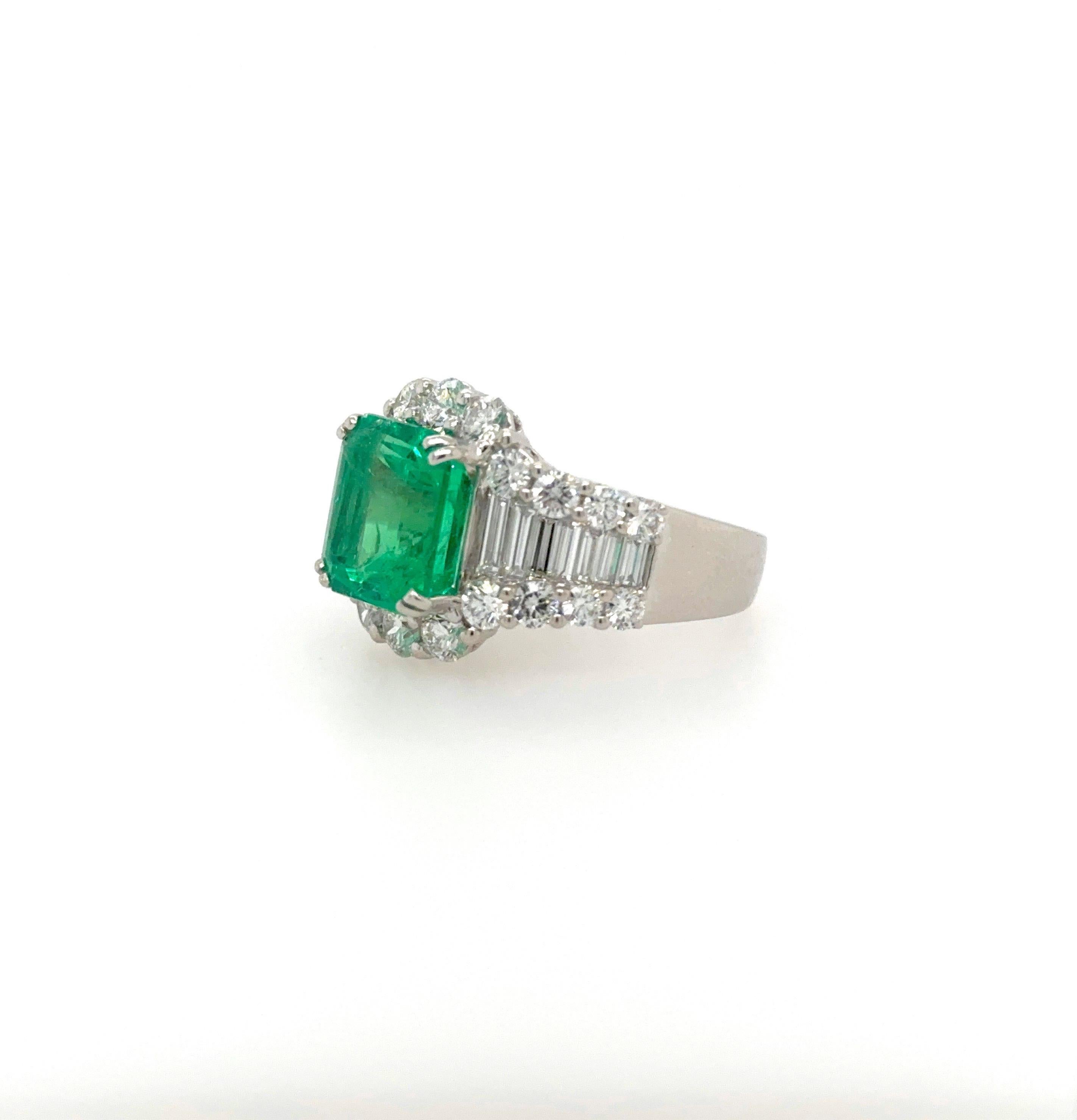 This impressive ring features a beautiful vivid green Colombian emerald weighing 5.37 carat and accompanied with a GIA certificate stating the origin as Colombia.
Total diamond weight is approximately 3.3 carats.
Round diamonds approximately 2.2