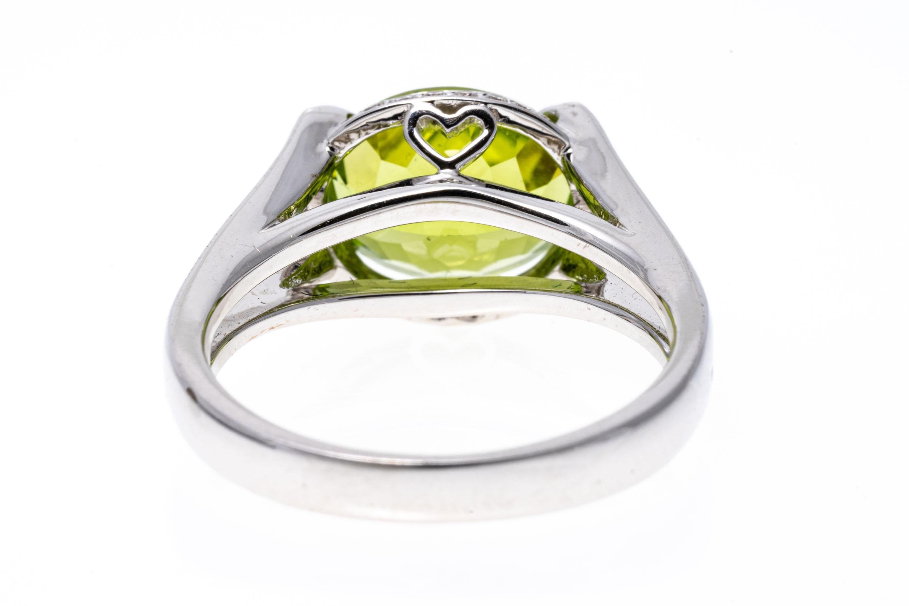 18k White Gold Contemporary Horizontal Peridot and Diamond Halo Ring For Sale 1