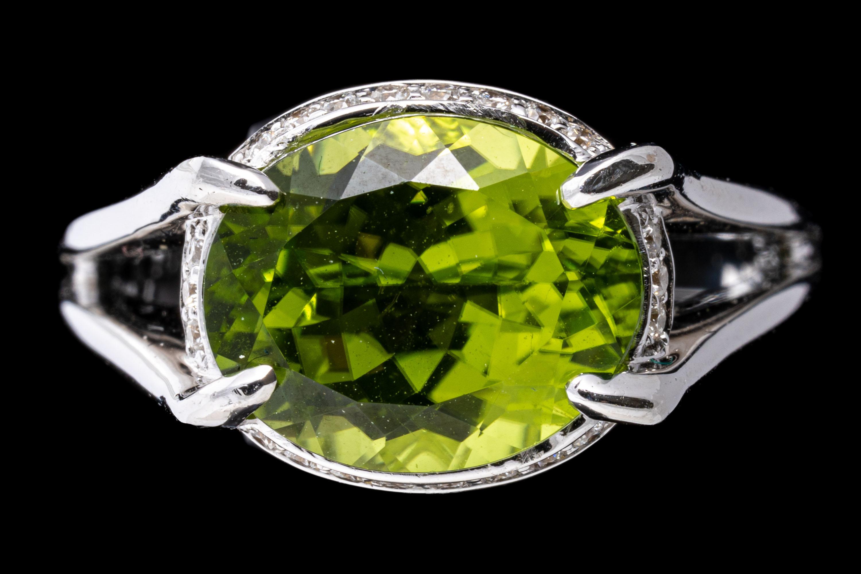 18k White Gold Contemporary Horizontal Peridot and Diamond Halo Ring For Sale 3