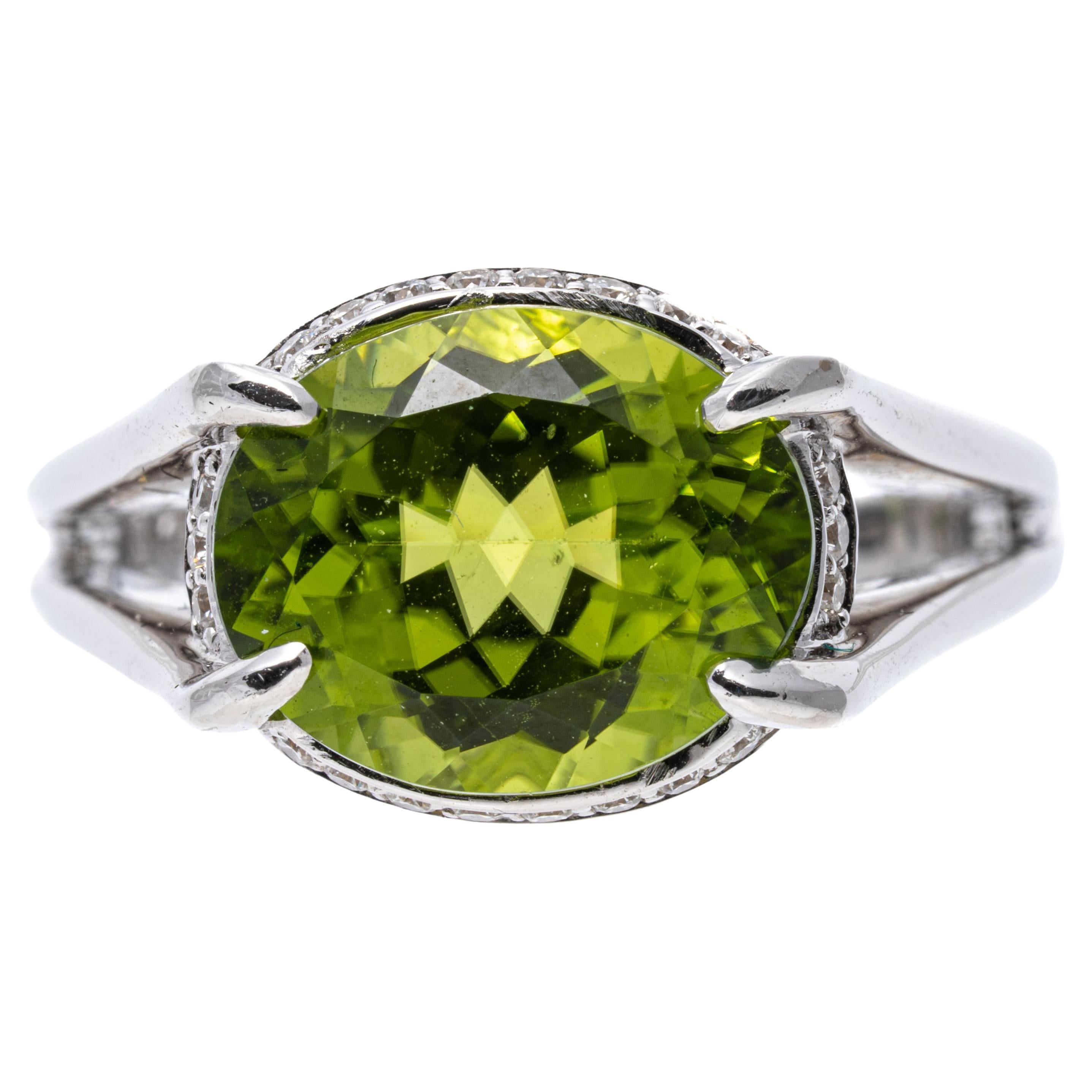 18k White Gold Contemporary Horizontal Peridot and Diamond Halo Ring For Sale