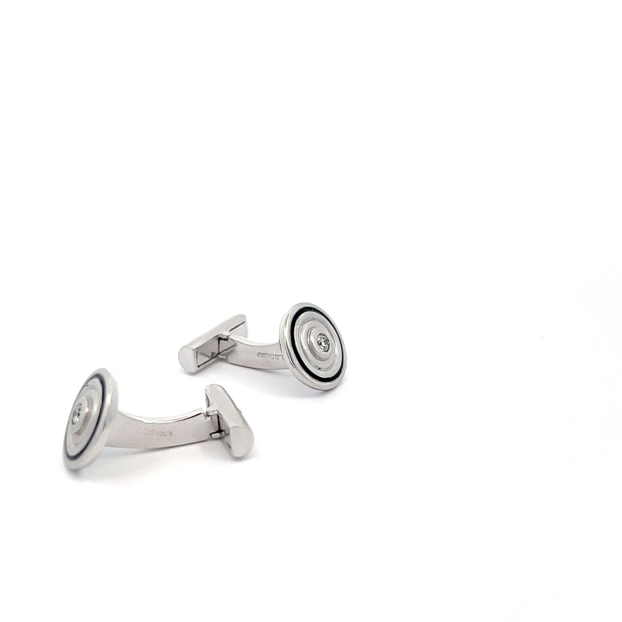 Indulge in the epitome of refined luxury with these 18k White Gold round cufflinks, a seamless fusion of classic design and contemporary allure. Each cufflink features a meticulously placed approximately 0.22 carats of glistening white diamonds,