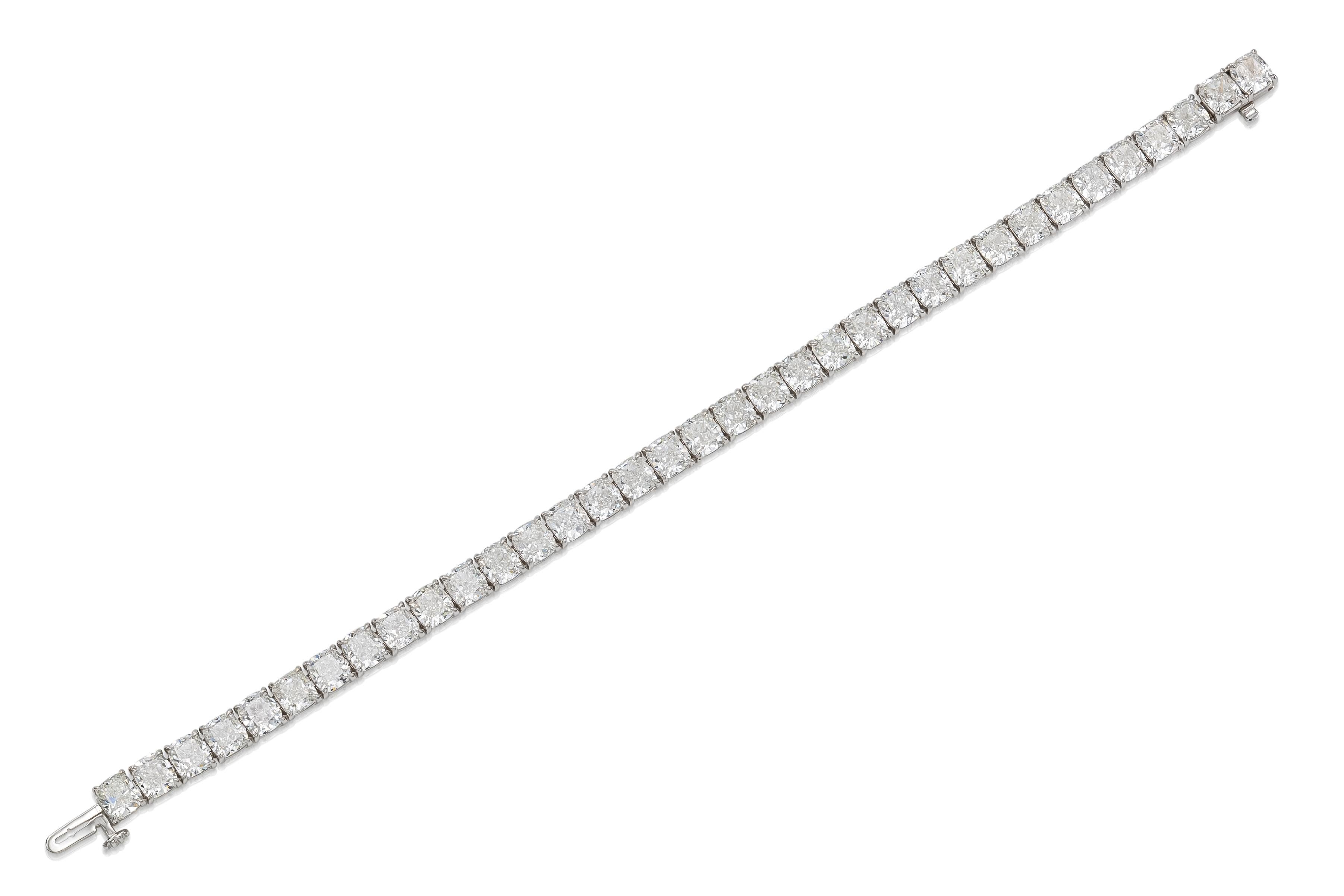 Handmade 18K White Gold Tennis Bracelet with 35 Cushion Cut Diamonds E-F-G color VVS1-VS2 clarity, all GIA certified weighting 24.76 carat, 7 inch long.