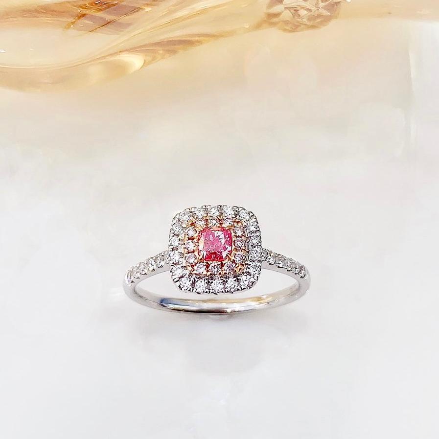 18K White Gold Fancy Pink Diamond Classic Ring

1 Pink Diamond - 0.18 CT
Diamonds - 0.51 CT (VS, F Colour)
18K White Gold - 2.57 GM

The pink diamond is a captivating and rare gemstone, its hue evoking the most delicate and precious things in