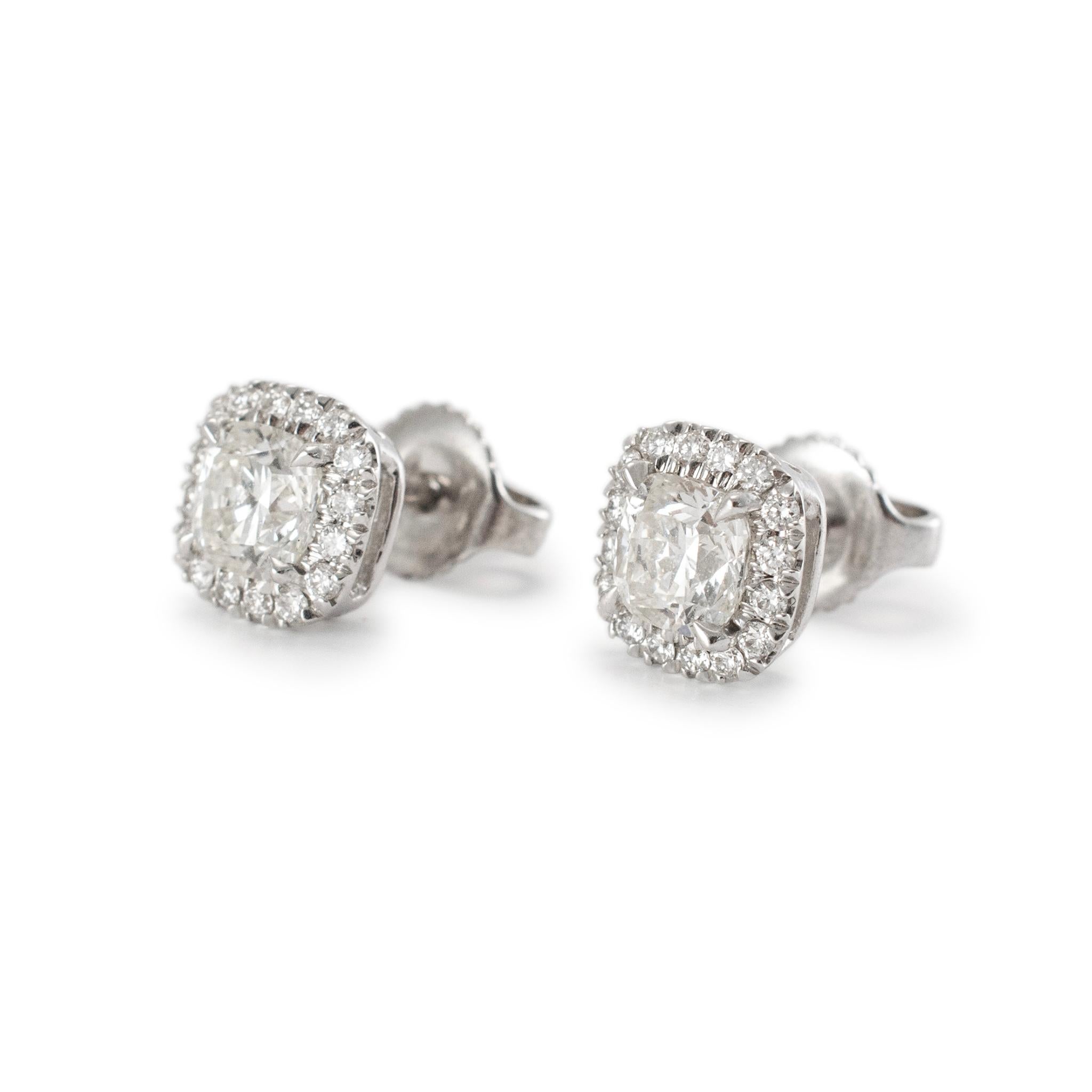 Gender: Ladies

Metal Type: 18K White Gold

Diameter: 7.50 mm

Weight:  2.38 grams

18K White Gold diamond halo, stud earrings with push backs. The metal was tested and determined to be 18K white gold. Engraved with 