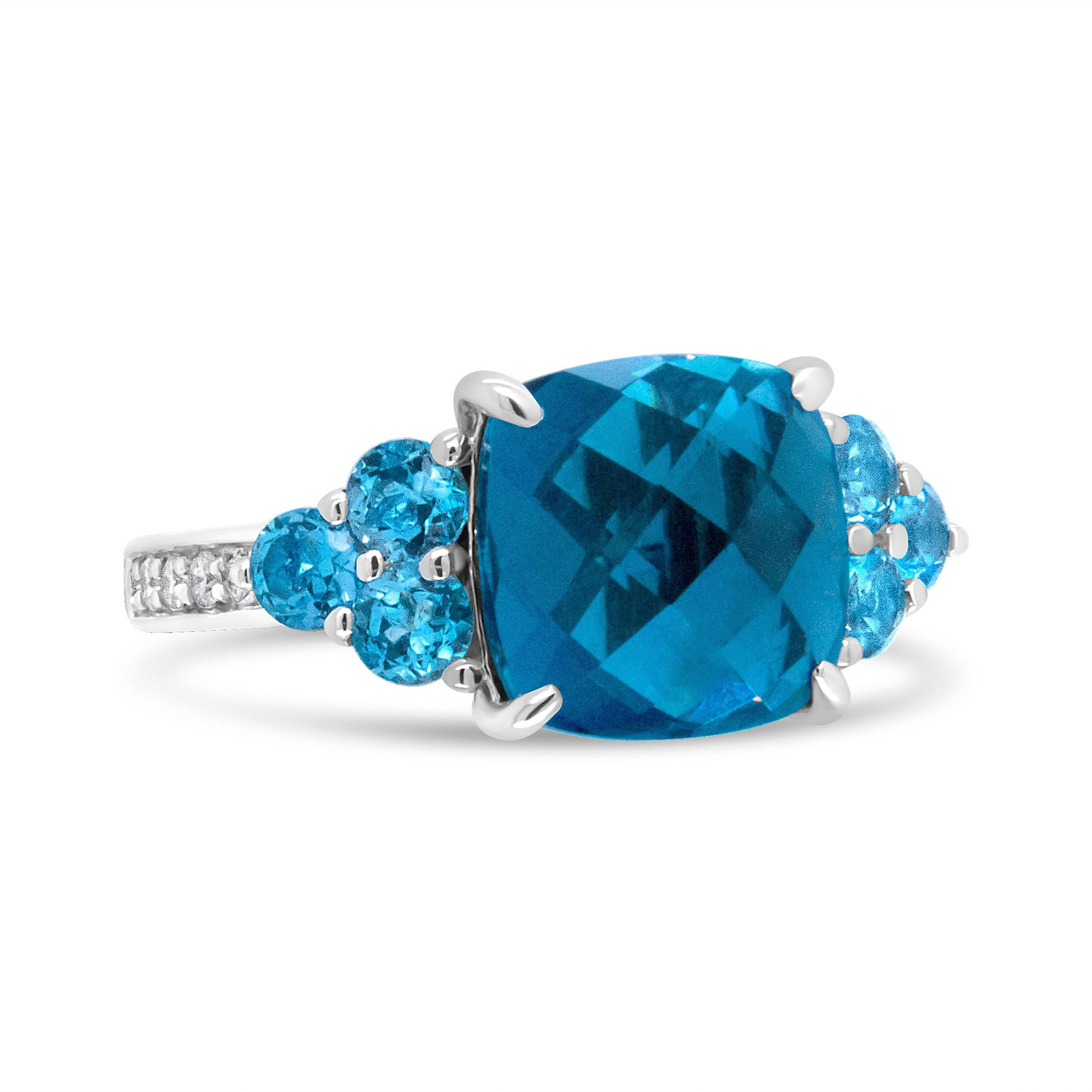 Blue is the new color of love. Wear love on your finger with this stunning blue topaz ring. A 10mm cushion shaped blue topaz gemstone sits as the central motif of this piece, flanked by 3 3.2 mm blue topaz gemstones on either side. The gemstones