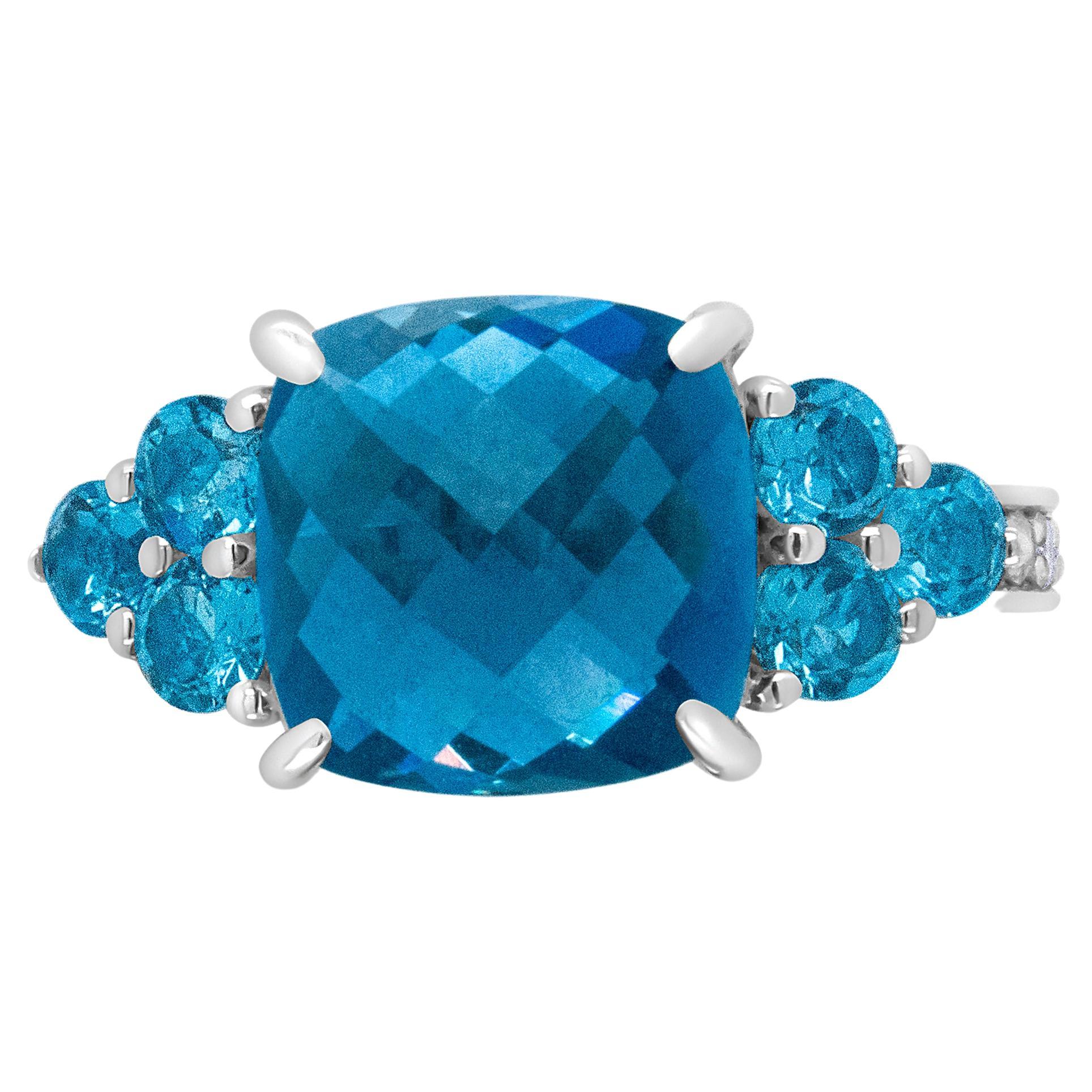 18K White Gold Cushion Shaped Blue Topaz & 1/6 Carat Diamond 3 Stone Style Ring For Sale